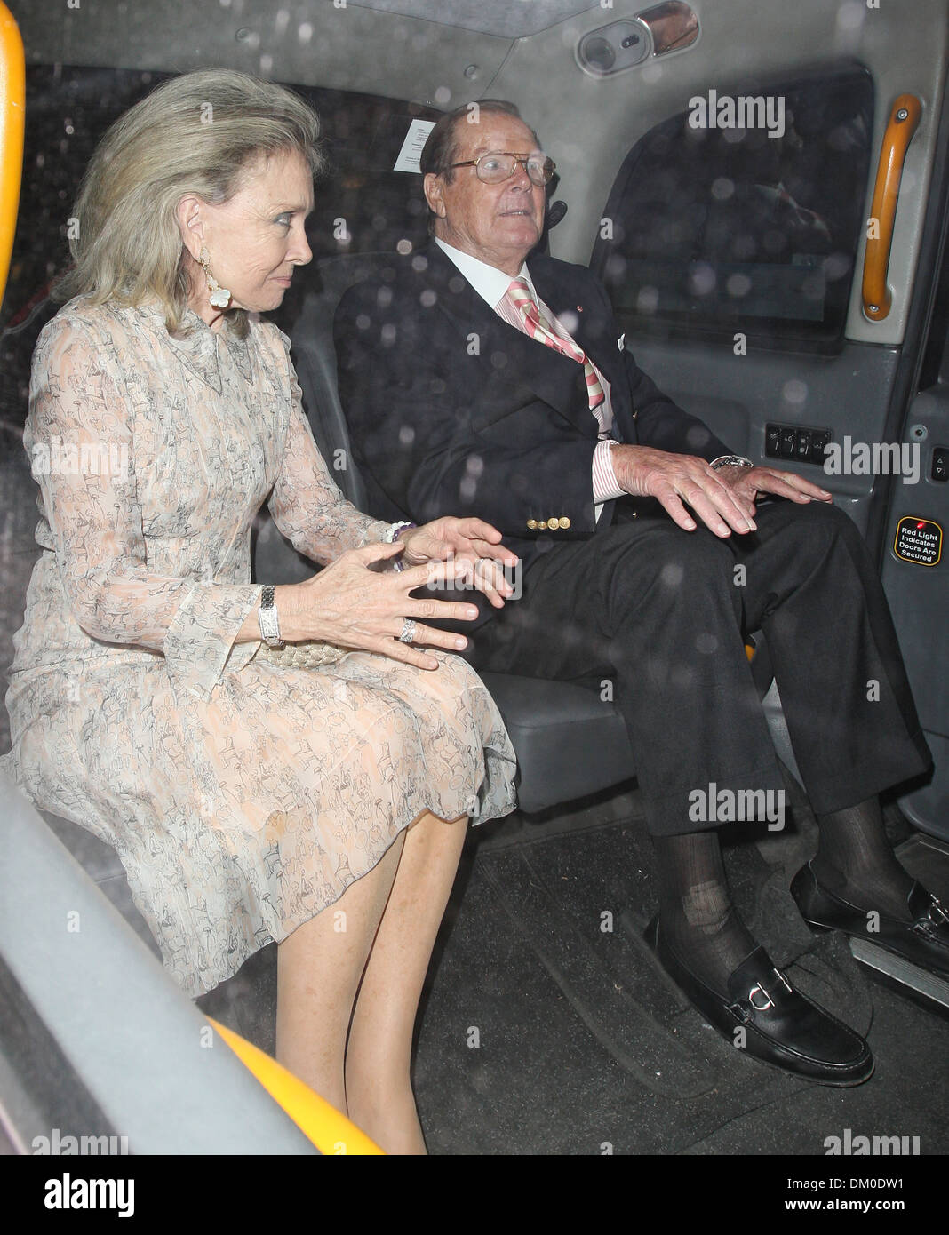 Sir Roger Moore and wife Kristina Tholstrup leaving Scotts Restaurant London England - 07.09.12 Stock Photo