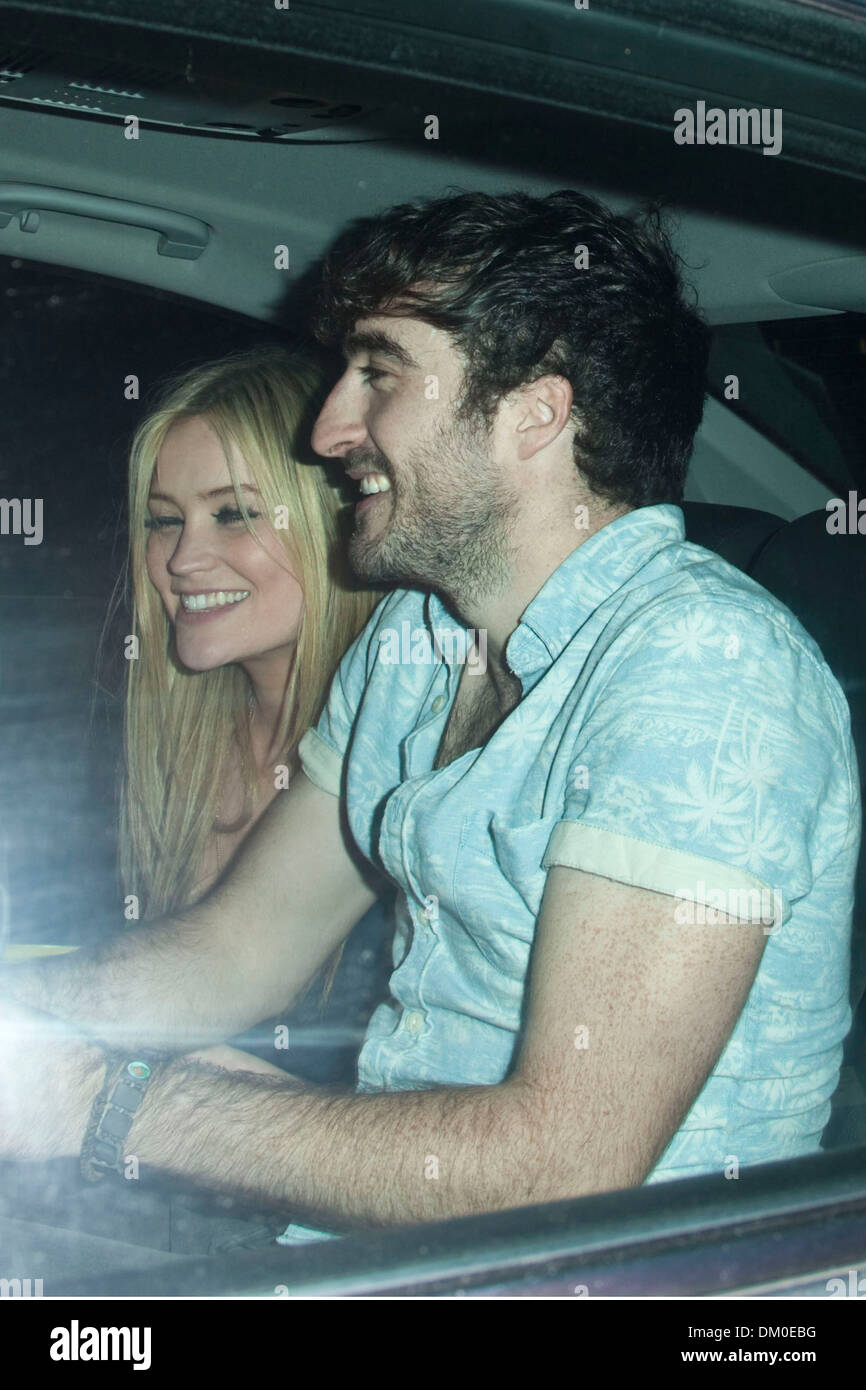 Laura Whitmore and a friend leave an afterparty at Mahiki nightclub in