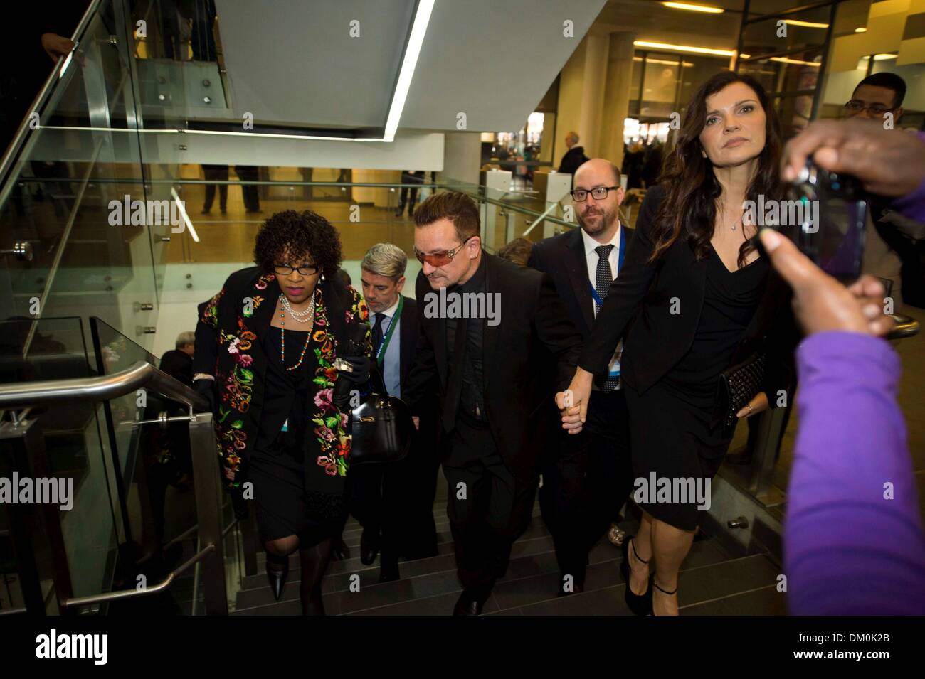 Johannesburg, South Africa. 10th Dec, 2013.  Bono and his wife attending Nelson Mandela's public Memorial Service at the FNB stadium on December 10, 2013, in Johannesburg, South Africa. The Father of the Nation passed away quietly on the evening of December 5, 2013 at his home in Houghton with family. He will be buried in Qunu for the official State funeral on December 15, 2013. Credit:  Gallo images/Alamy Live News Stock Photo