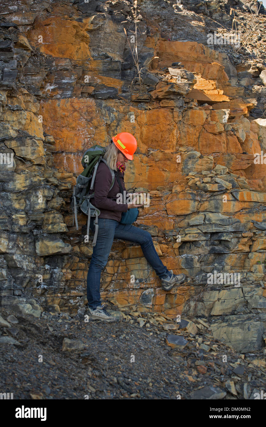Female Geologist examining Marcellus shale, near Marcellus New York
