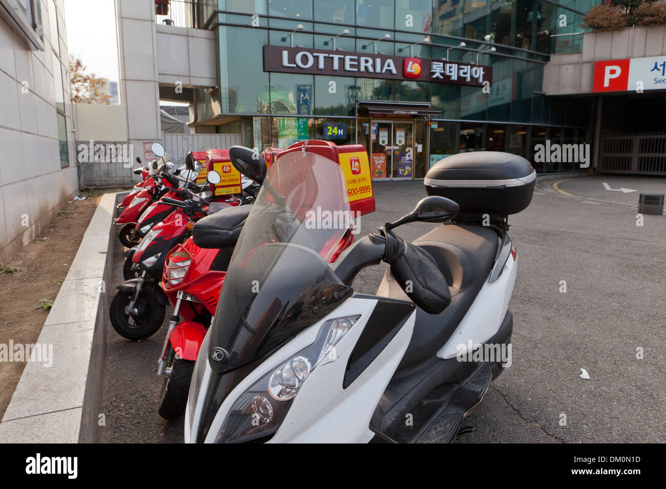 Lotteria fast food delivery scooters Seoul, South Korea Stock Photo