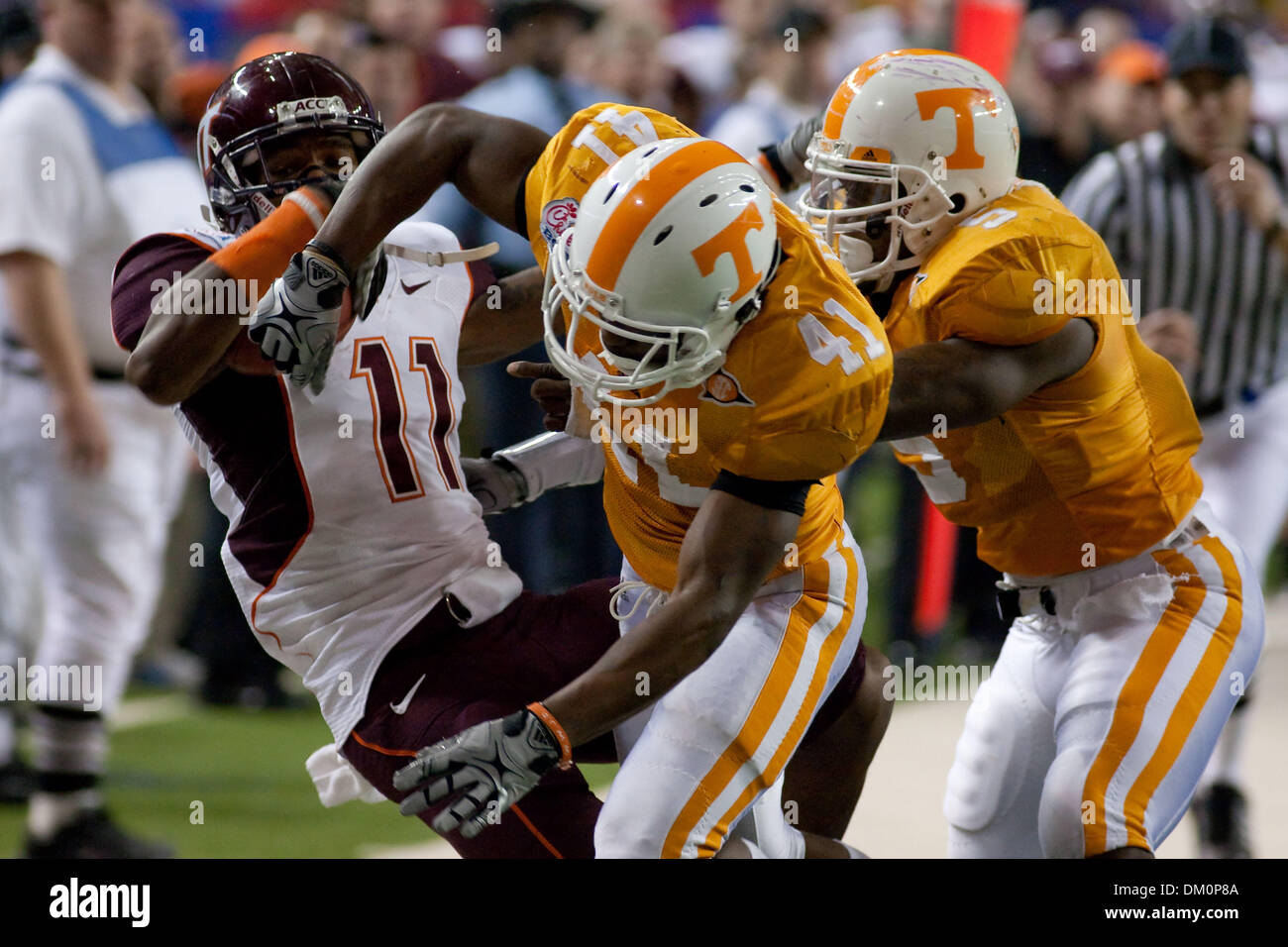 Dec. 31, 2009 - Atlanta, Georgia, USA - 31 December 2009:  Atlanta, Georgia. Virginia Tech wide receiver Dyrell Roberts gets thrown out of bounds by Tennessee cornerback Dennis Rogan in the second half against the Tennessee Volunteers in the Chick Fil A Bowl. (Credit Image: © Jeremy Brevard/Southcreek Global/ZUMApress.com) Stock Photo