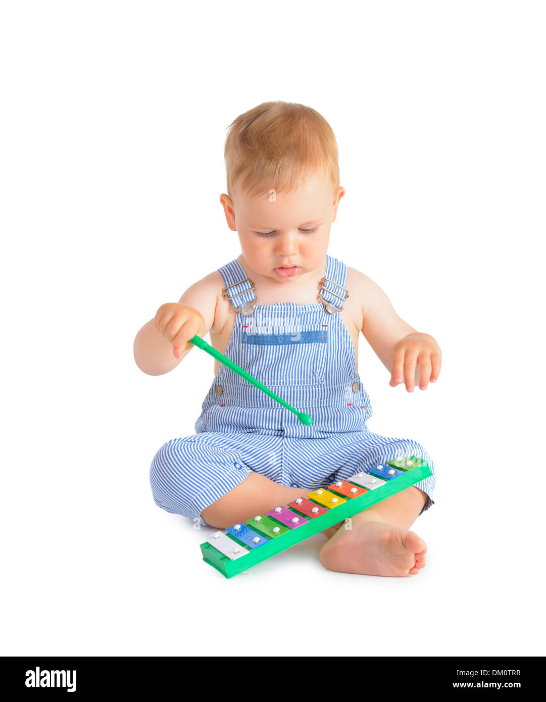 Cheerful baby boy playing on xylophone isolated over white background Stock Photo Alamy