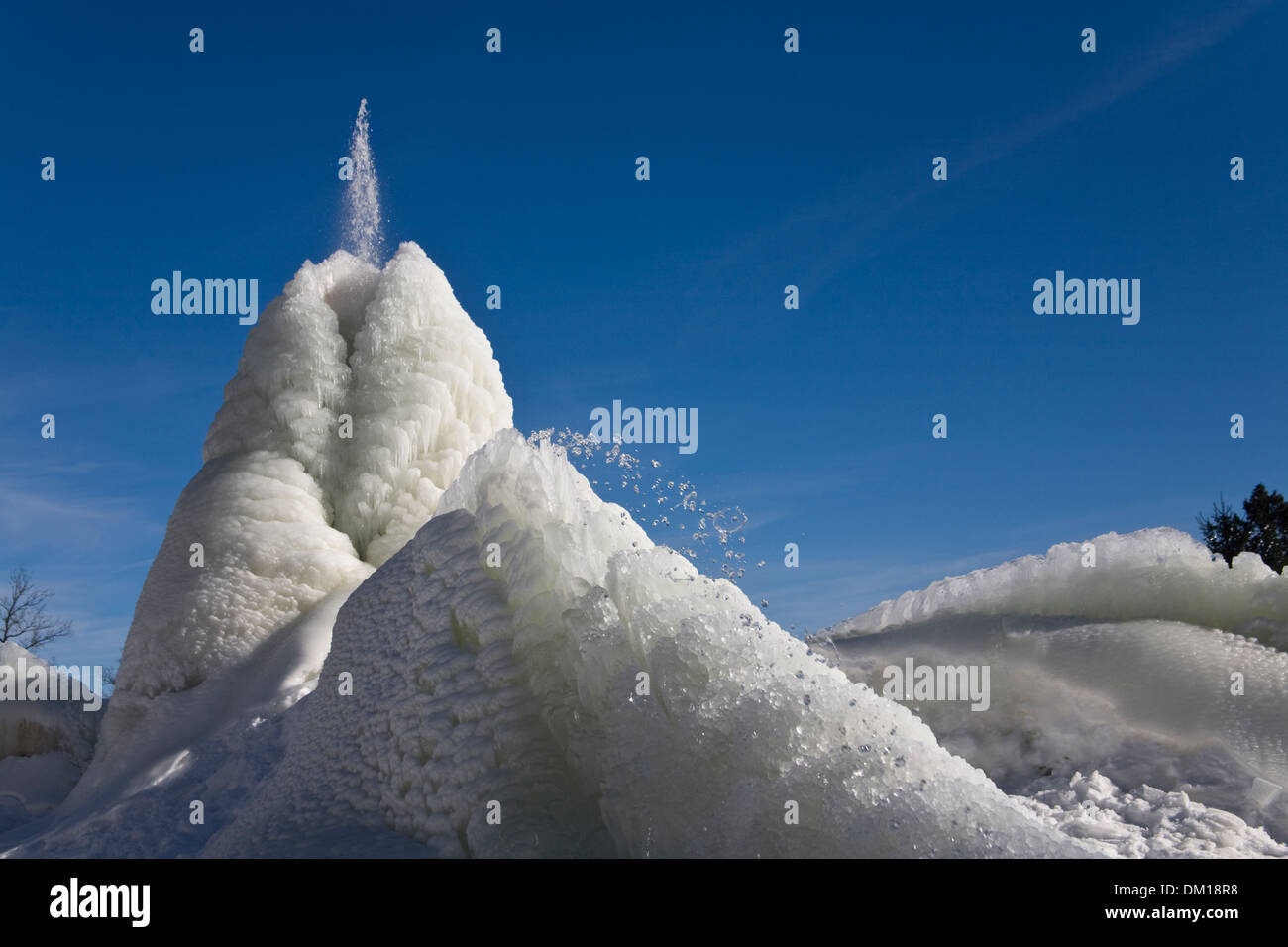Ice formation made by Water fountain Drop Winter White Blue Stock Photo