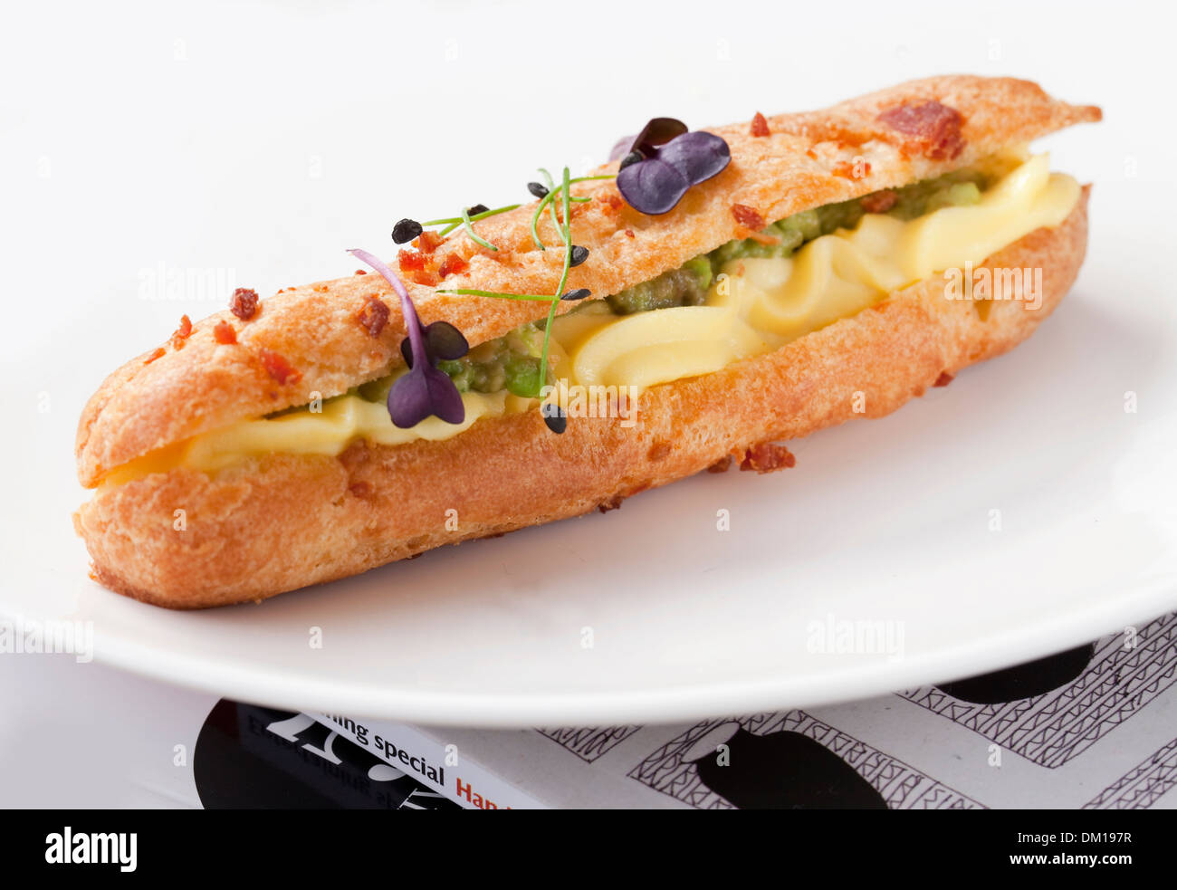 Devilled egg and avocado eclair Stock Photo