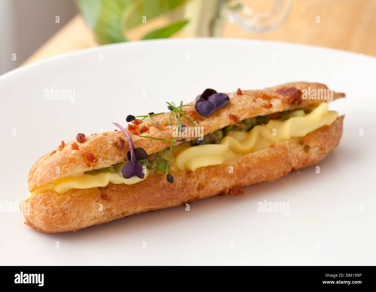 Devilled egg and avocado eclair Stock Photo