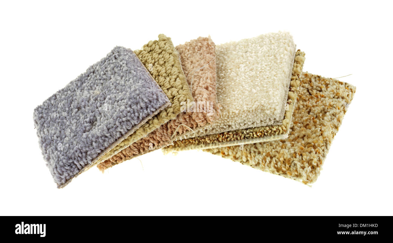 Several small squares of carpet samples on a white background Stock