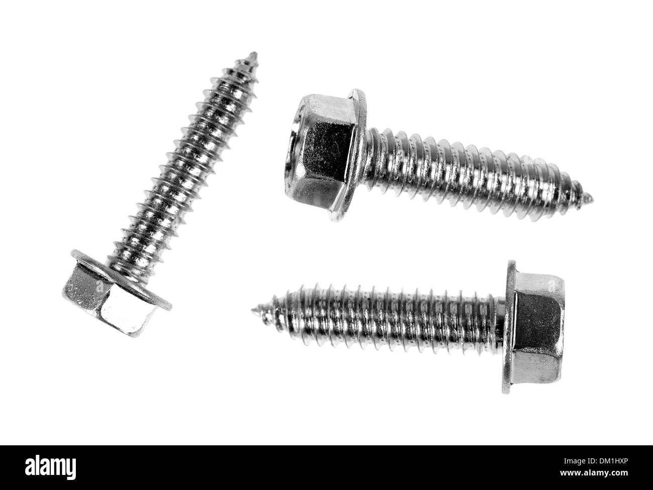 A group of three hex head cutting screws on a white background. Stock Photo