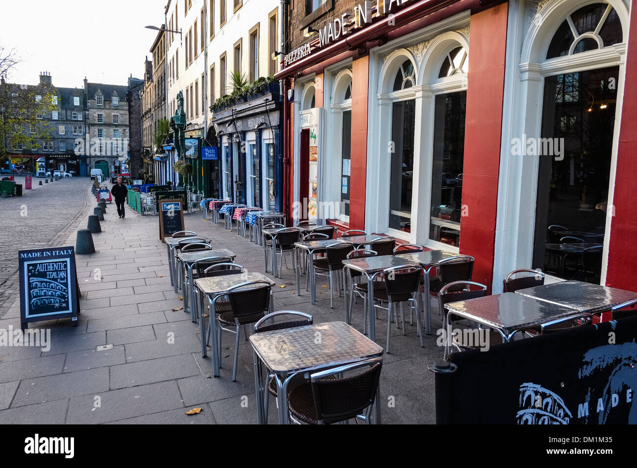 Tables and chairs outside a pub in the Grassmarket in Edinburgh Stock