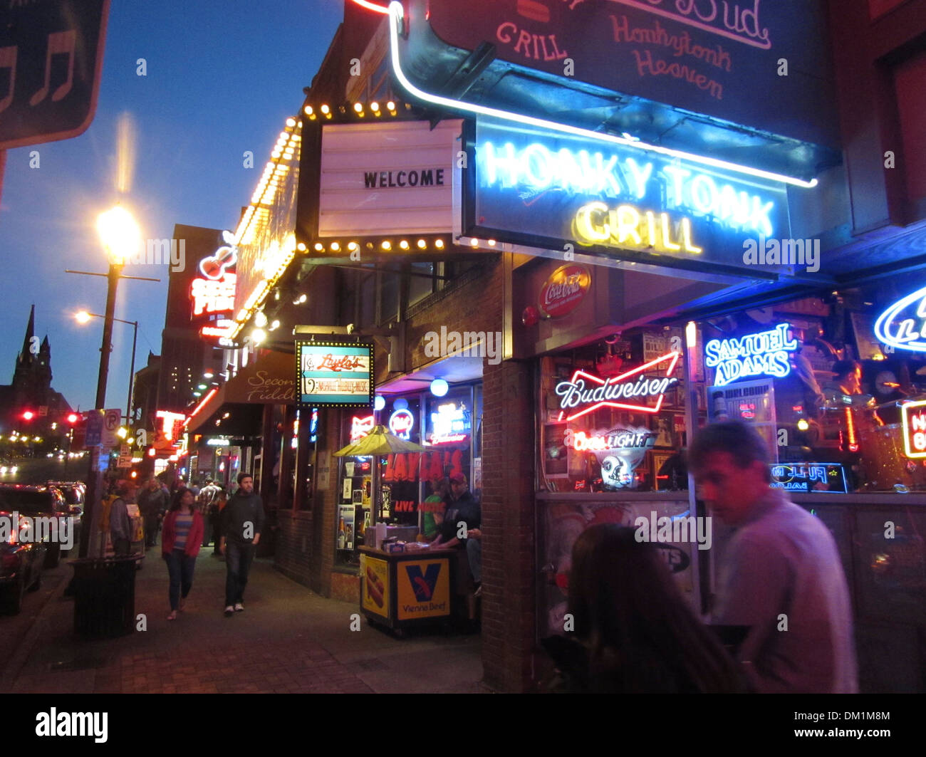 Exterior of Honky Tonk bars, lounges, and clubs and their neon signs on Broadway in downtown Nashville Tennessee. Stock Photo