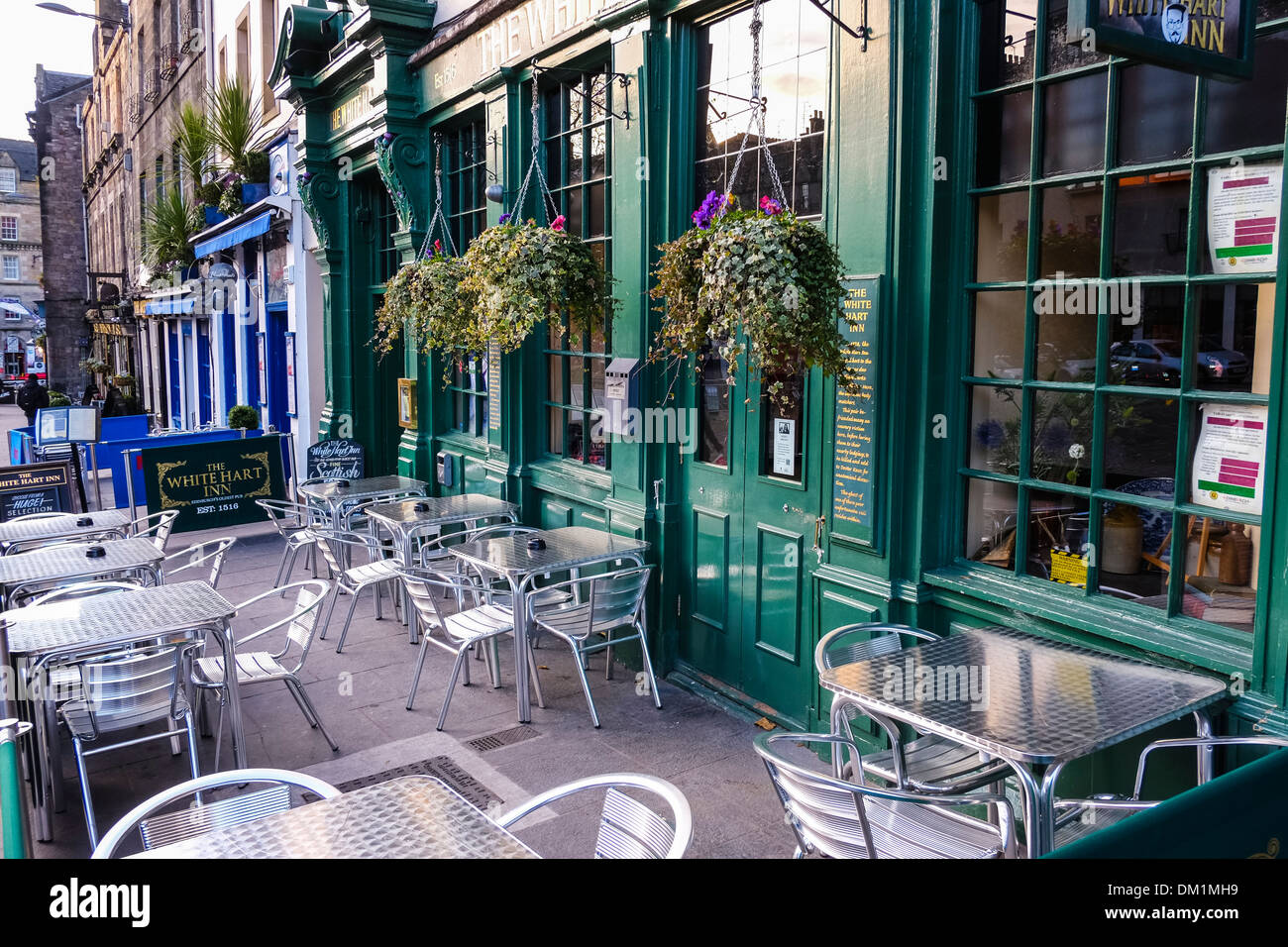 Tables and chairs outside the 'White Hart Inn' pub in Edinburgh's