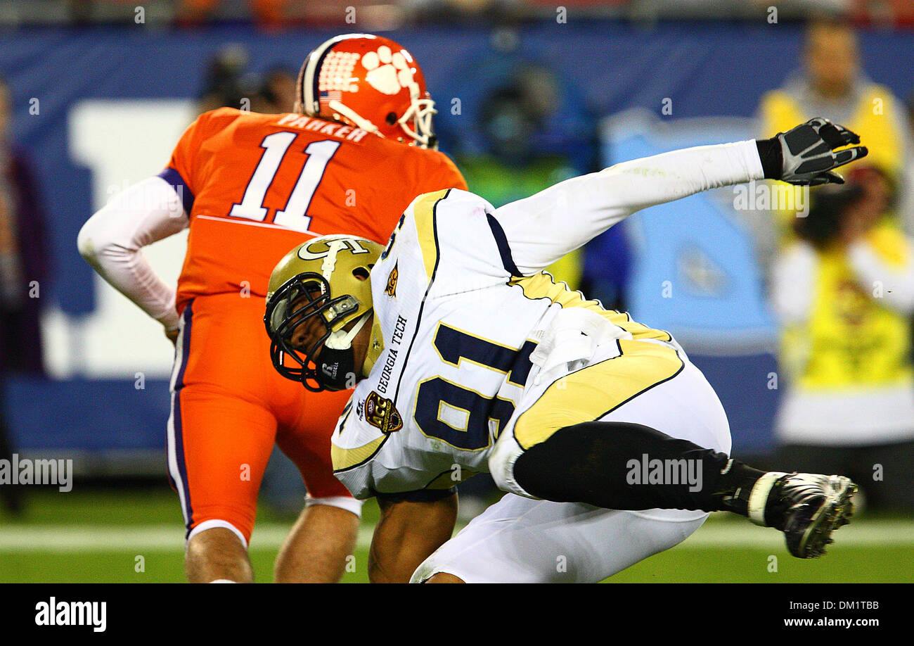 Clemson quarterback Kyle Parker #11 avoids a tackle during the first half of the Dr Pepper Atlantic Coast Conference Football Championship Game between the Georgia Tech Yellow Jackets and the Clemson Tigers being played at Raymond James Stadium in Tampa, FL. (Credit Image: © Chris Grosser/Southcreek Global/ZUMApress.com) Stock Photo