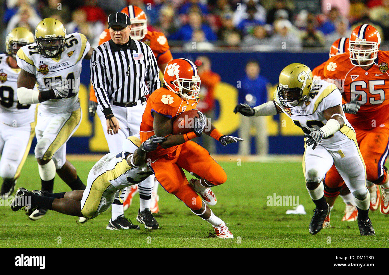 Clemson running back Andre Ellington #23 is taken down by a Georgia Tech player during the first half of the Dr Pepper Atlantic Coast Conference Football Championship Game between the Georgia Tech Yellow Jackets and the Clemson Tigers being played at Raymond James Stadium in Tampa, FL. (Credit Image: © Chris Grosser/Southcreek Global/ZUMApress.com) Stock Photo