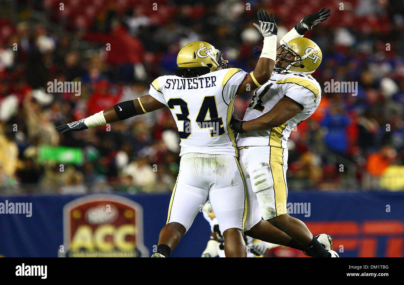 Georgia Tech linebacker Steven Sylvester #34 celebrates with a teammate during the first half of the Dr Pepper Atlantic Coast Conference Football Championship Game between the Georgia Tech Yellow Jackets and the Clemson Tigers being played at Raymond James Stadium in Tampa, FL. (Credit Image: © Chris Grosser/Southcreek Global/ZUMApress.com) Stock Photo