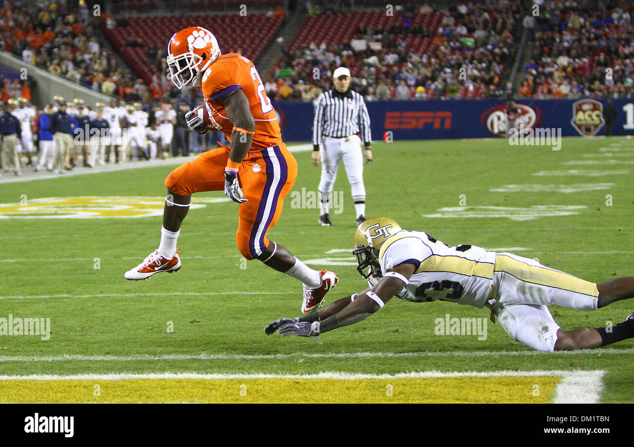 Clemson running back C.J. Spiller #28 leaps over a Georgia Tech opponent to score the first touchdown of the game during the first half of the Dr Pepper Atlantic Coast Conference Football Championship Game between the Georgia Tech Yellow Jackets and the Clemson Tigers being played at Raymond James Stadium in Tampa, FL. (Credit Image: © Chris Grosser/Southcreek Global/ZUMApress.com) Stock Photo