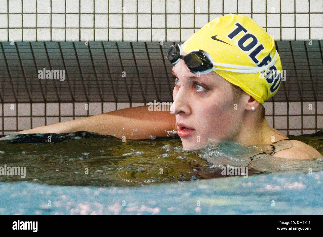 A Toledo swimmer looks to the scoreboard to see her time during meet