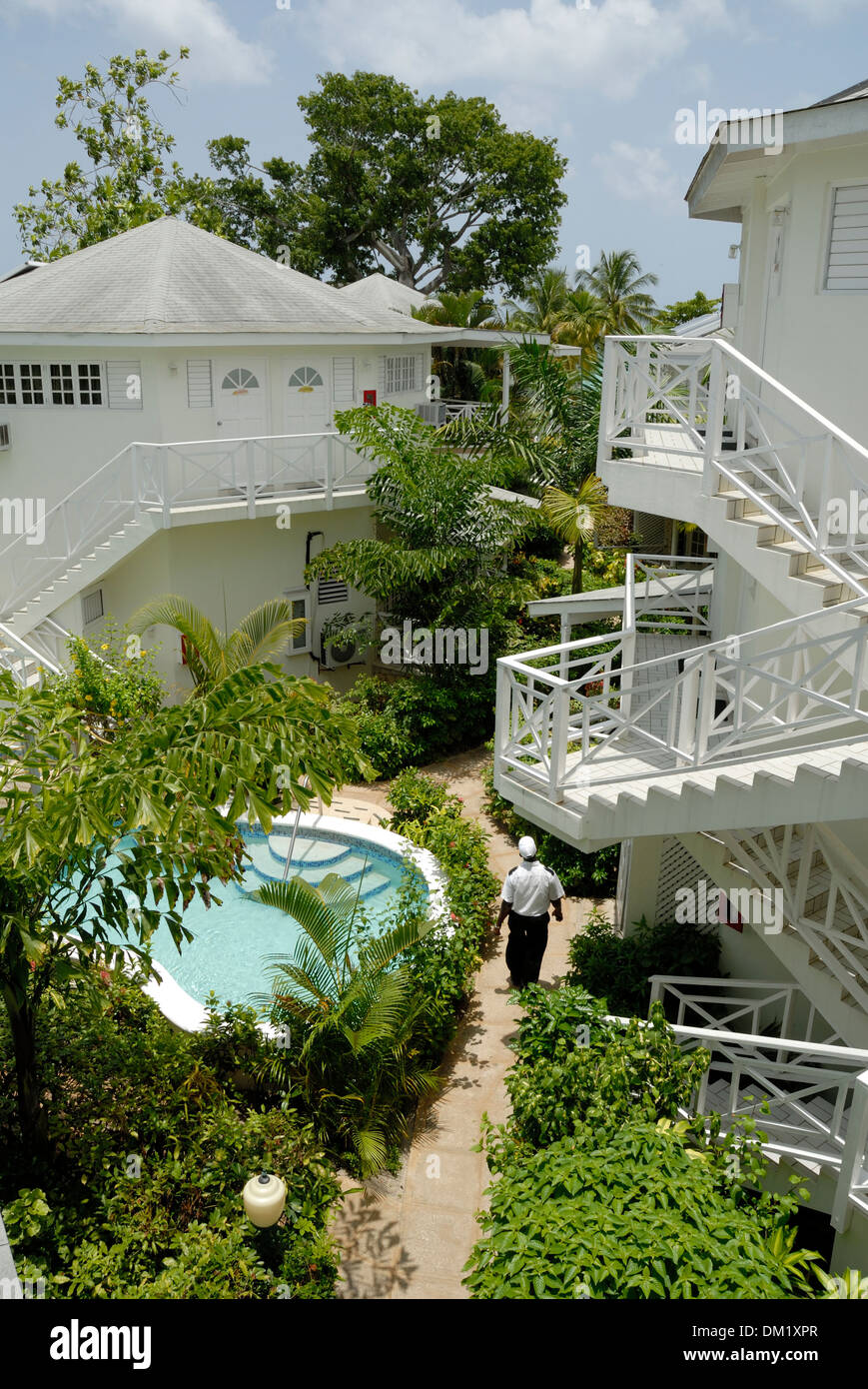 Landscaped Grounds with Security Guard at Rondel Village Hotel at 7