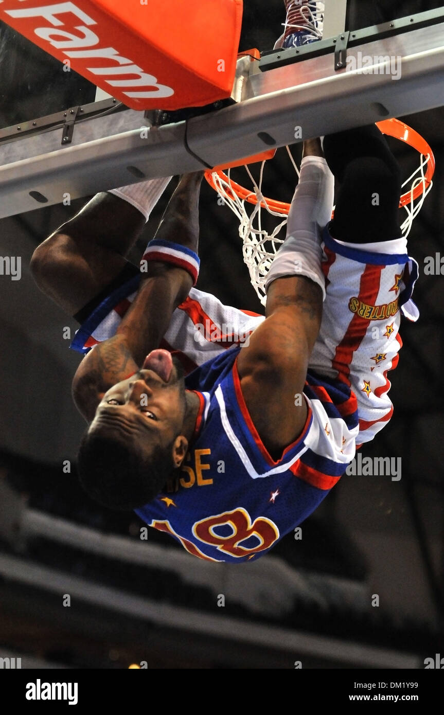 Harlem Globetrotters' Hi Rise Brown 18 hangs upside down on the