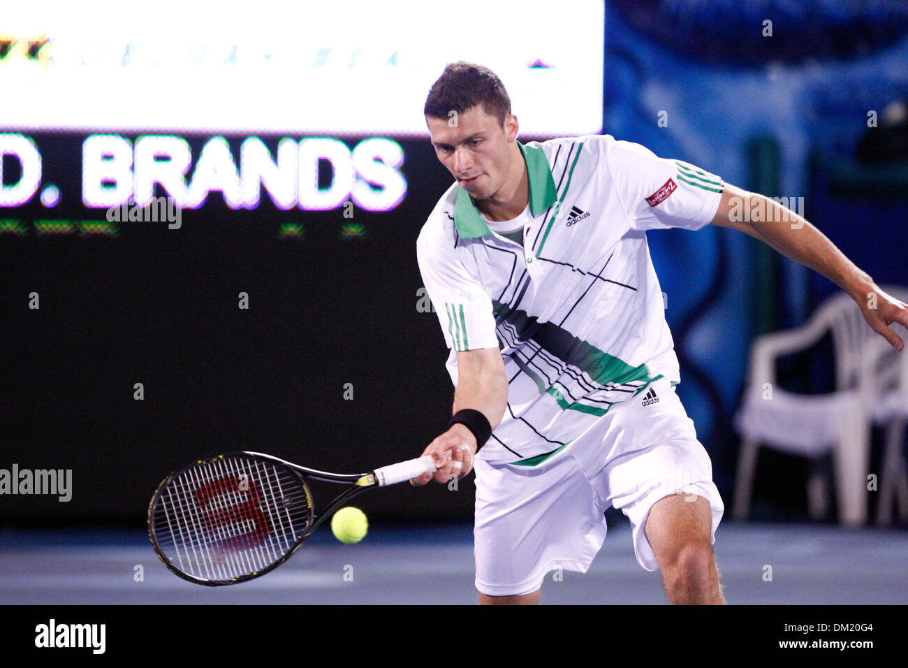 ATP Singles World Tour player Daniel Brands of the Germany returns the ball  to match winner Ivo Karlovic of Croatia during the second round of the ATP  Delray Beach International Tennis Championships