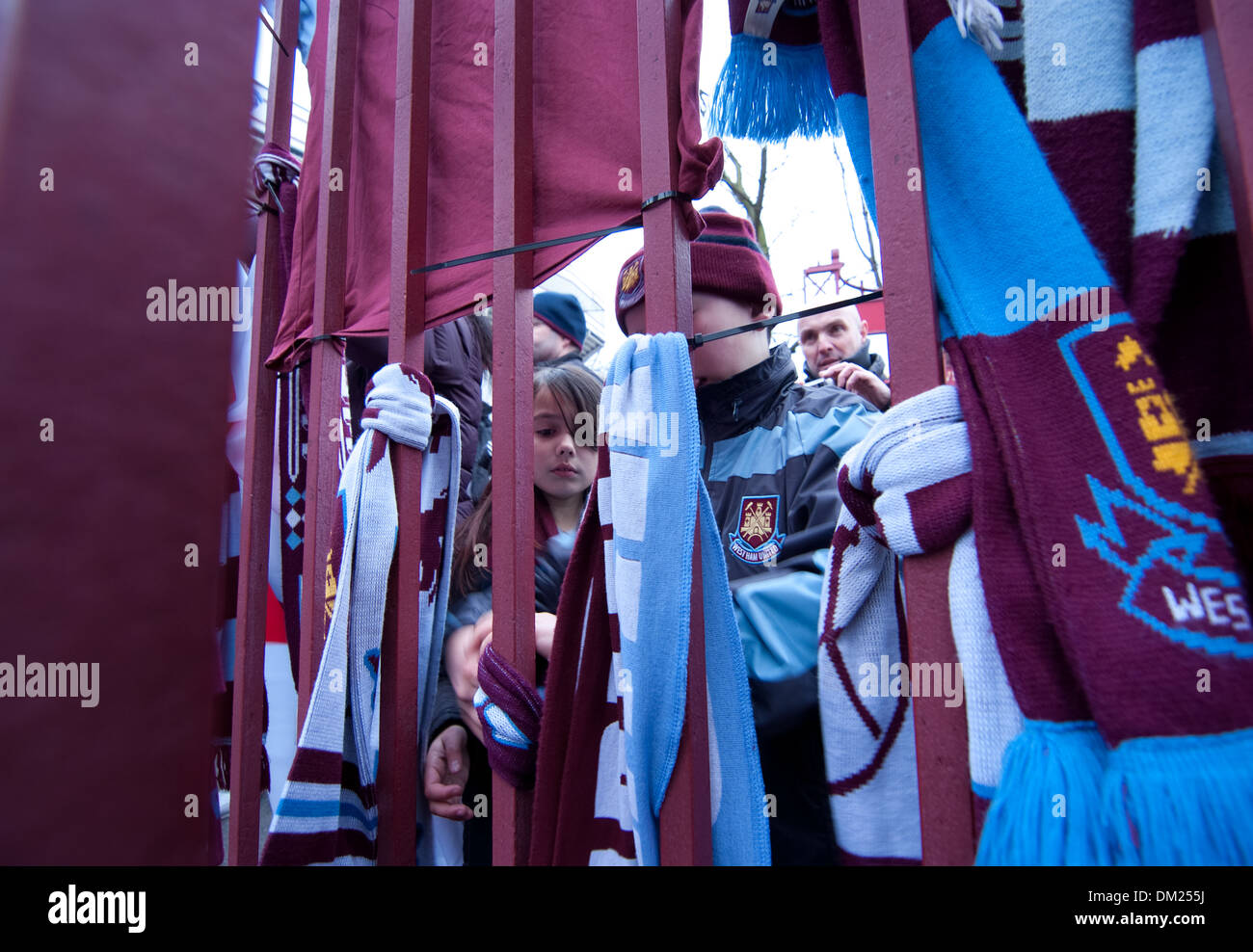 football fans tie claret and blue scarfs to the gates of upton park during the 20th anniversary of the death of Bobby Moore Stock Photo