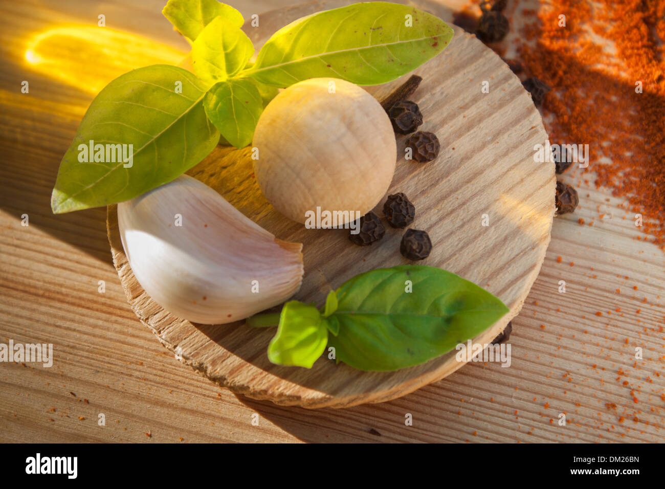 cooking spices seasoning close-up light garlic 'garlic glove' natural pepper [black peppercorn] basil Stock Photo