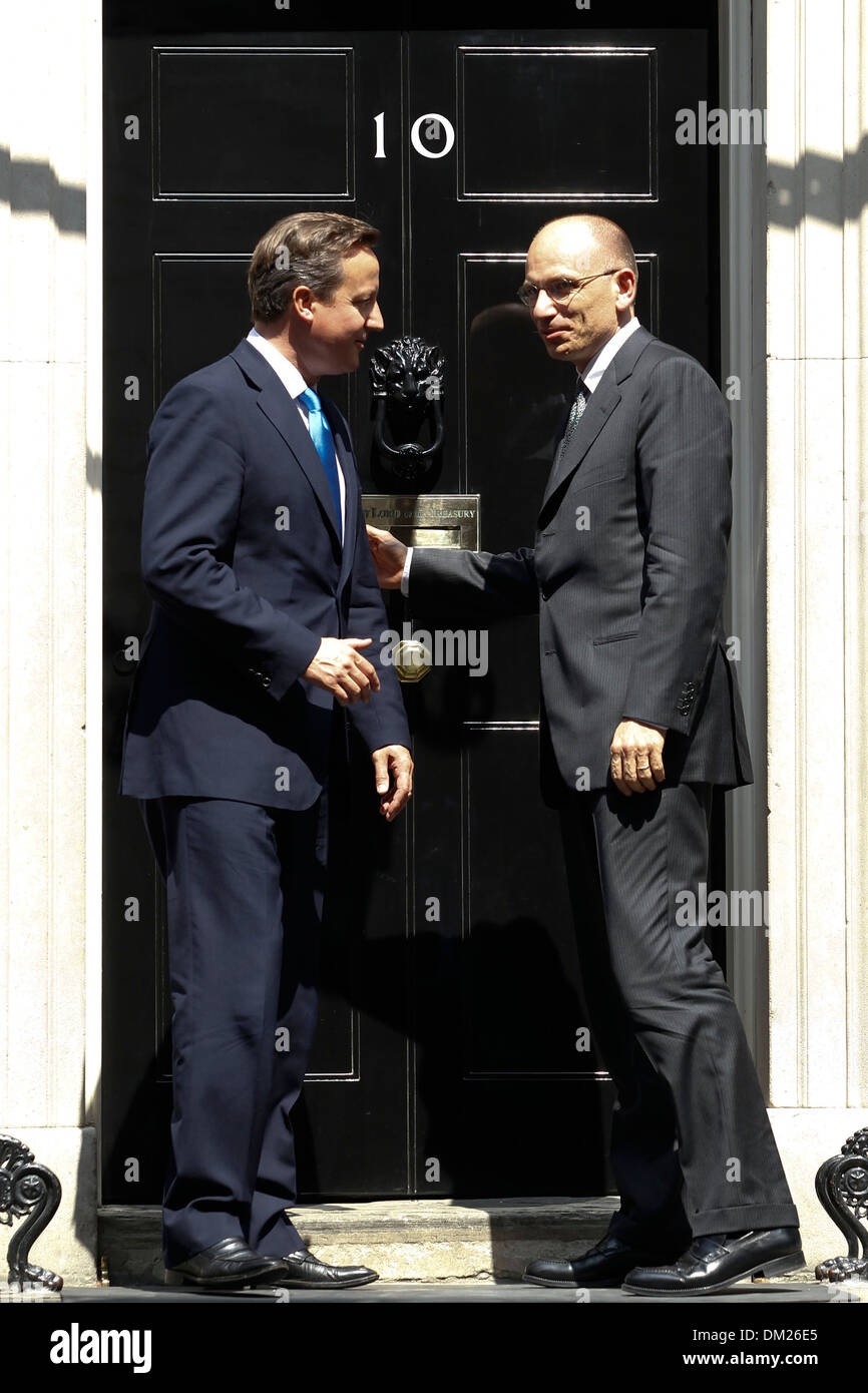 Italian Prime Minister Enrico Letta (R) shakes hands with British Prime Minister David Cameron Stock Photo