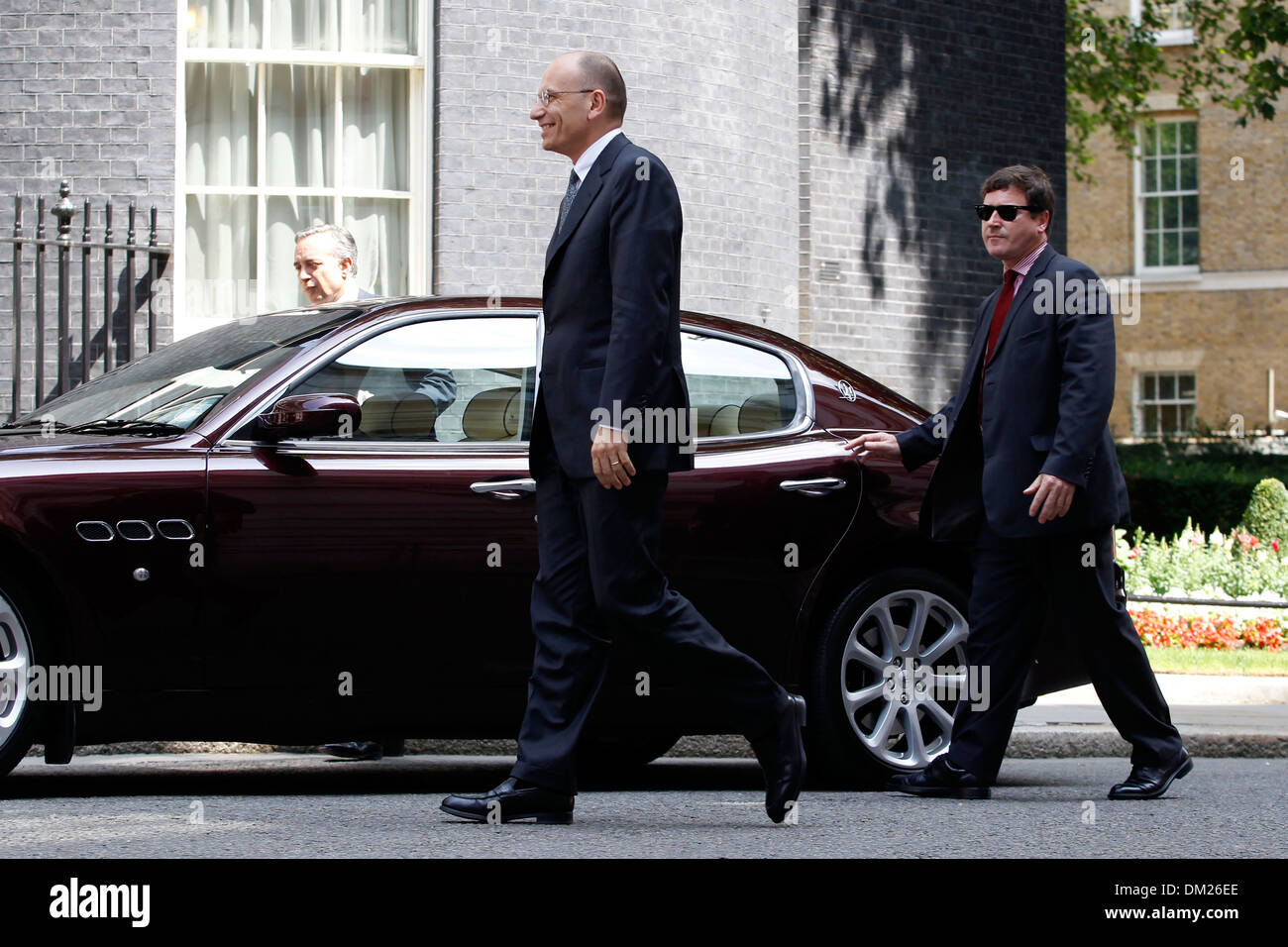 Italian Prime Minister Enrico Letta (R) shakes hands with British Prime Minister David Cameron Stock Photo