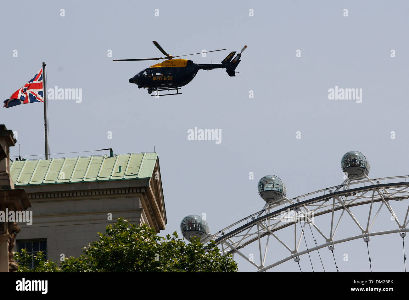 A police helicopter above the London Eye and Number 10 Downing Street in London, Britain, 17 July 2013. Stock Photo