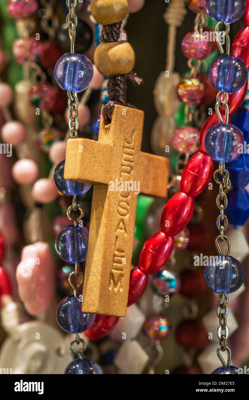 Rosary beads and cross at a Catholic shrine. Stock Photo
