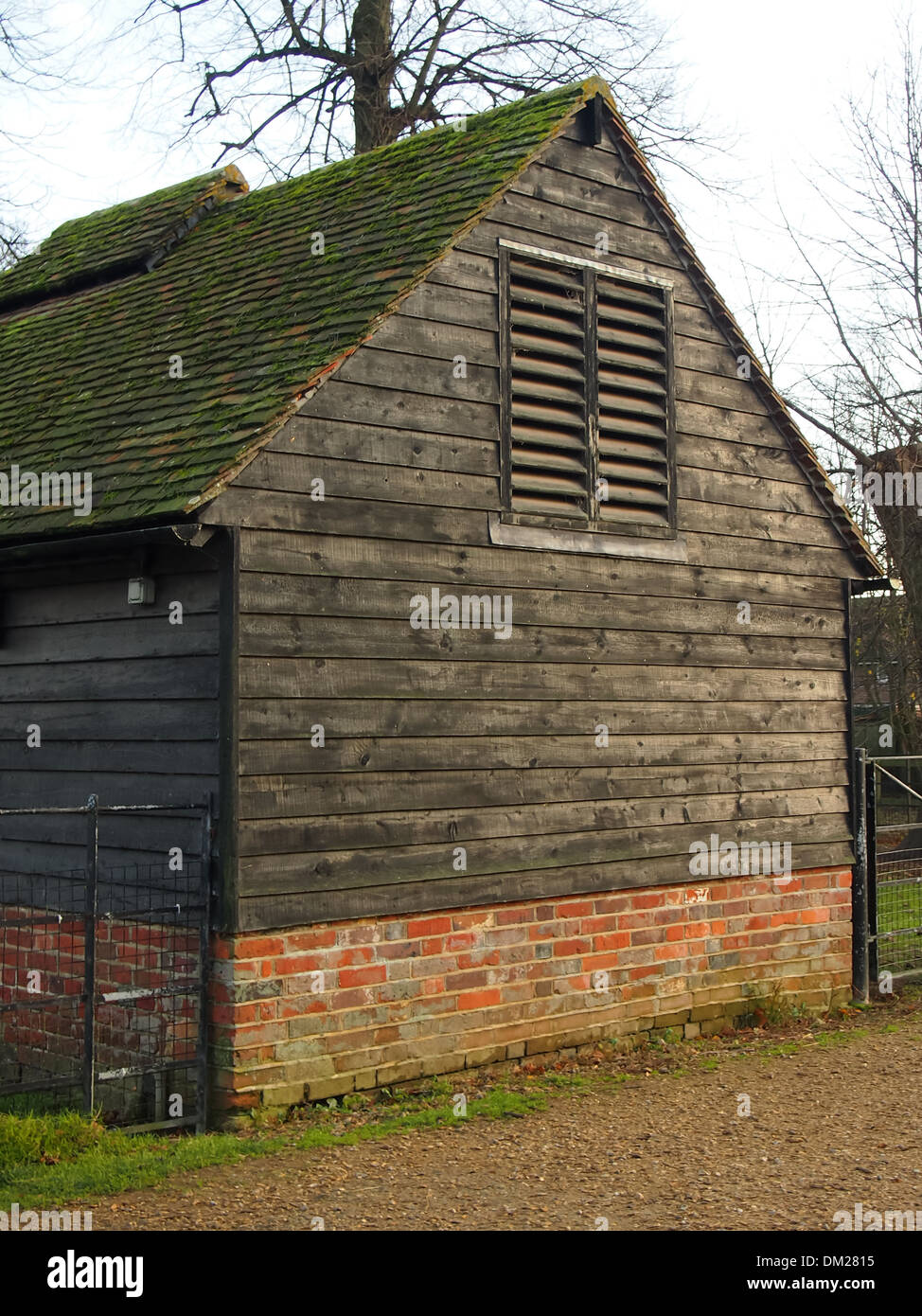 Wooden and brick farmyard Barn Stock Photo
