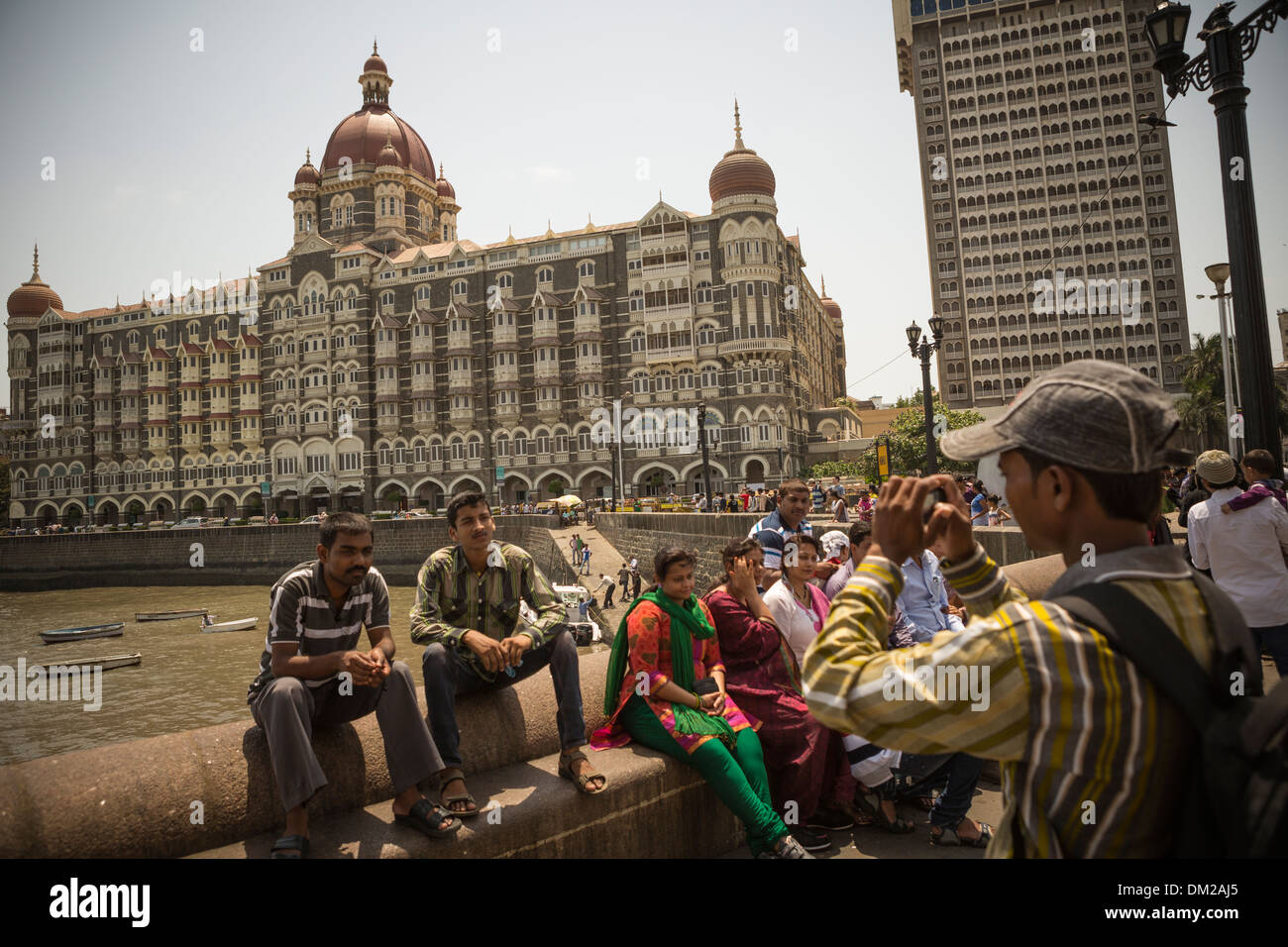 Tourists outside the Taj Mahal Palace hotel in Mumbai (Bombay), India. Stock Photo