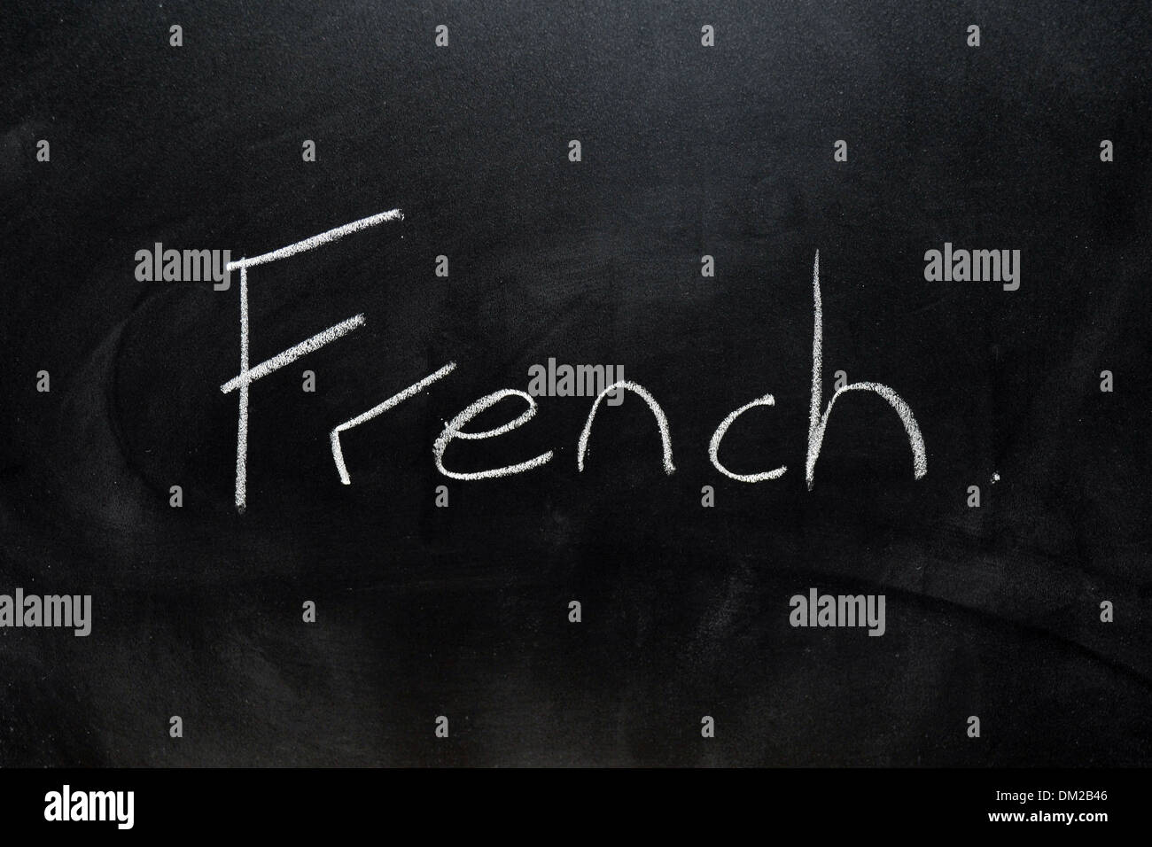 Close up of a blackboard with French written on it in chalk Stock Photo