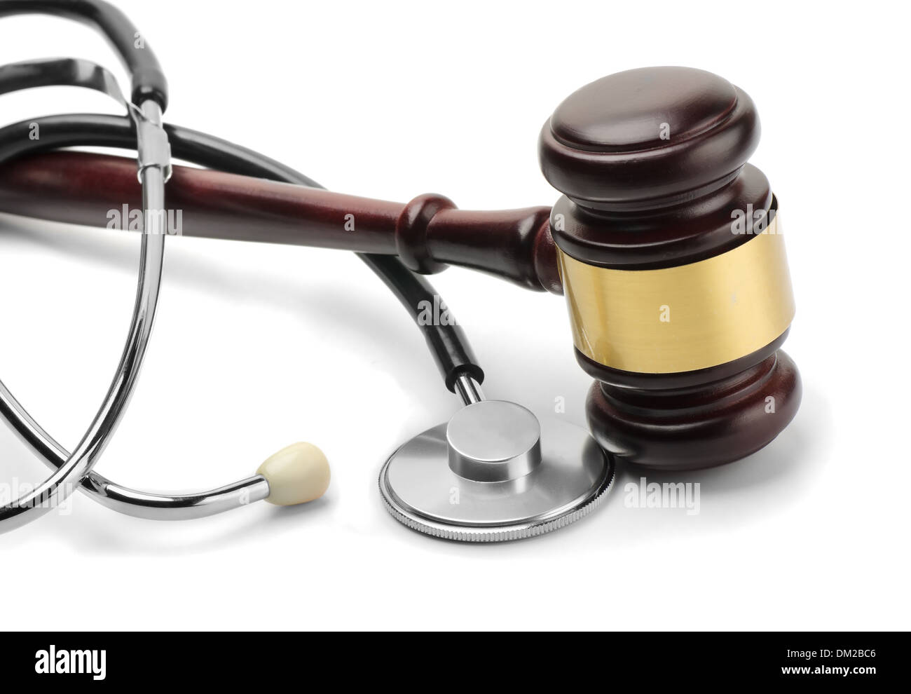 Close up of stethoscope and gavel on white background Stock Photo
