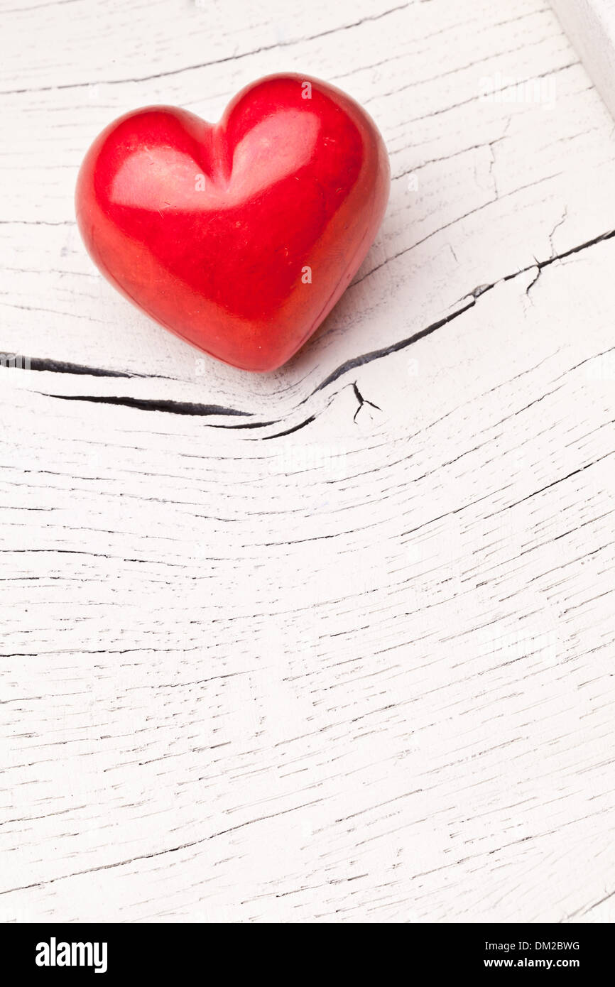 Valentines Day. Red heart on a white wooden table. Stock Photo