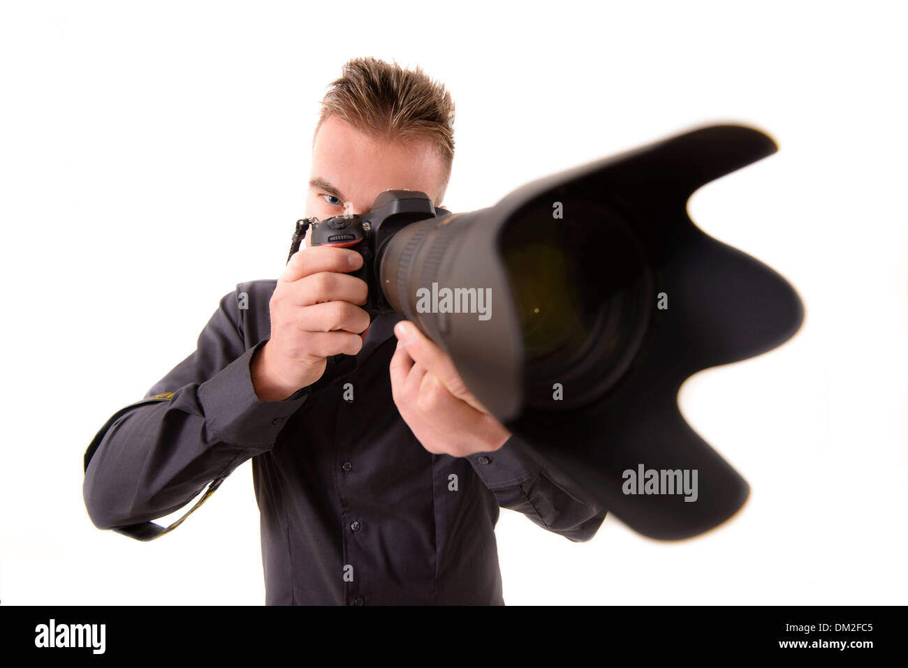 Professional Photographer taking Shot with a Telephone Lens Stock Photo