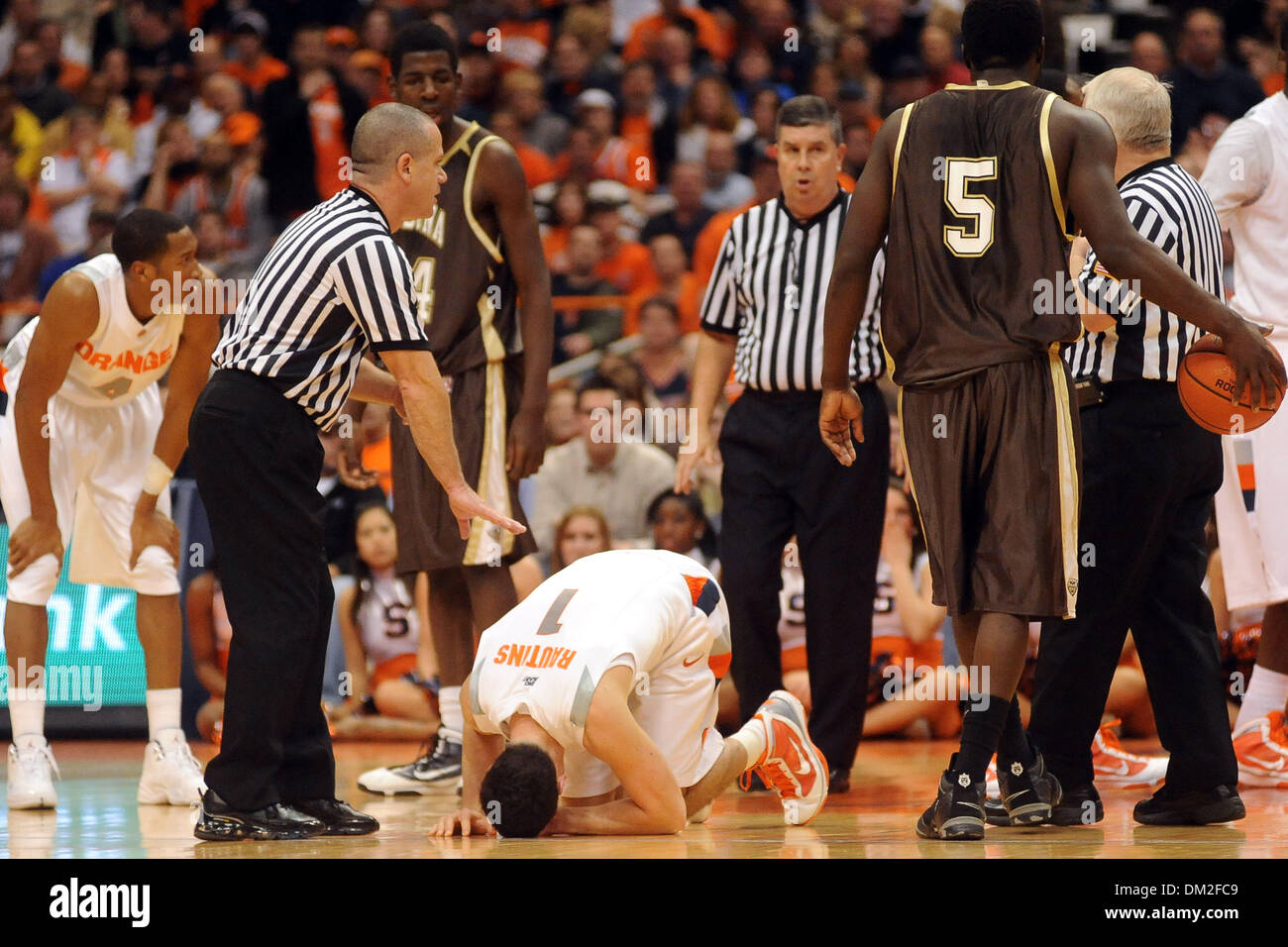 Syracuse guard Andy Rautins (1) sits on the court in pain fouling a hit by St. Bonaventure forward Andrew Nicholson (44) in the second half. St. Bonaventure forward Andrew Nicholson (44) was ejected from the game after hitting Rautins in the groin. Syracuse defeated St. Bonaventure 85-72 in a physical game at the Carrier Dome in Syracuse, NY. (Credit Image: © Michael Johnson/Southc Stock Photo