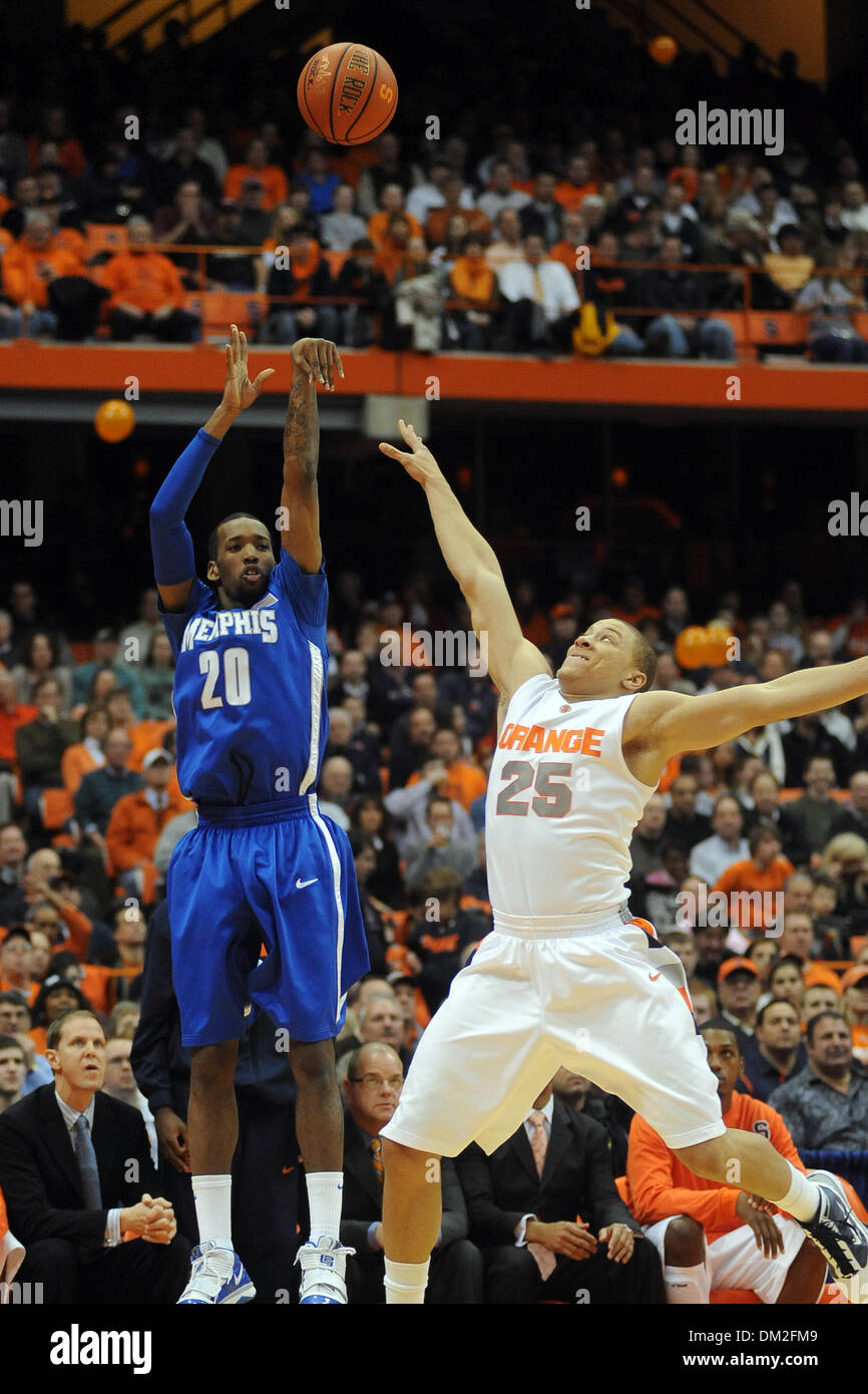 Memphis guard Doneal Mack (20) launches the three point shot over