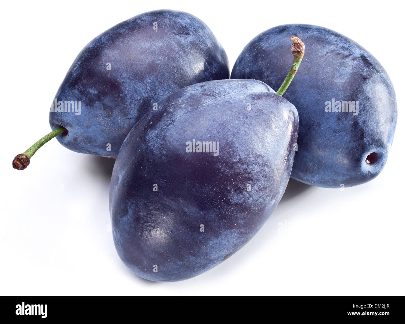 Three plums with leaf isolated on a white background. Stock Photo