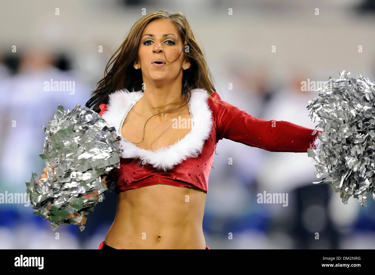 Members of the famous Dallas Cowboys Cheerleaders in Santa Helper