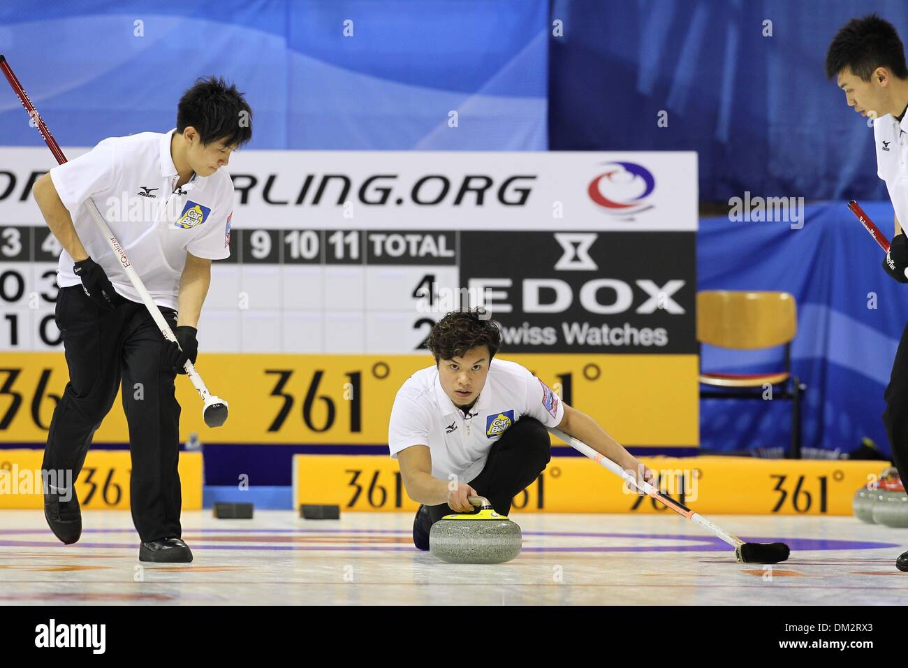 Arena Fuessen, Germany. 10th Dec, 2013. Japanes curlers Kosuke Morozumi (L-R), Tsuyoshi Yamaguchi and Tetsuro Shimizu compete against South Korea during the Olympic Qualification in Arena Fuessen, Germany, 10 December 2013. Photo: Karl-Josef Hildenbrand/dpa/Alamy Live News Stock Photo