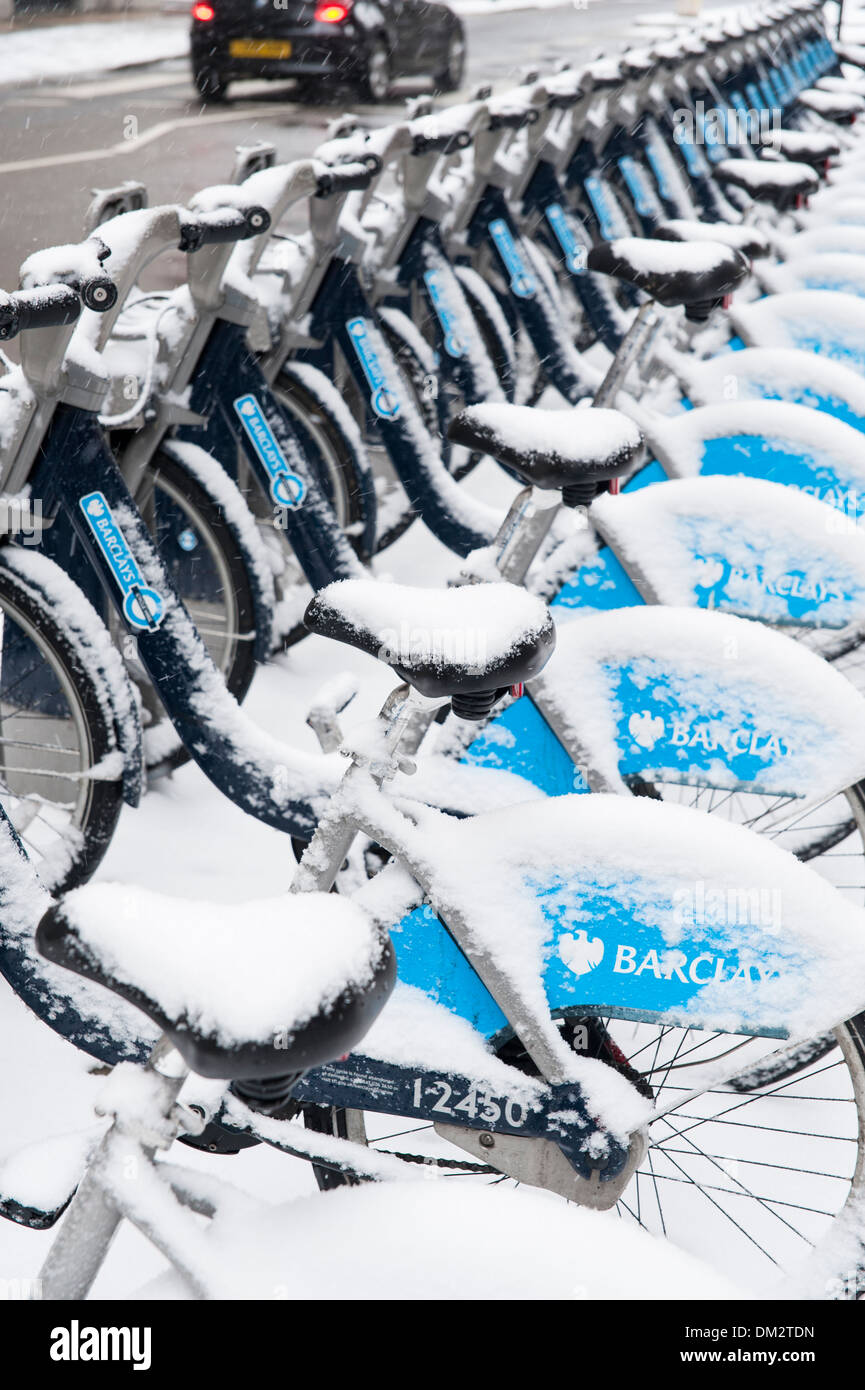 Barclays Cycle Hire. Snow covered bike rental station in the City of London, London, England Stock Photo