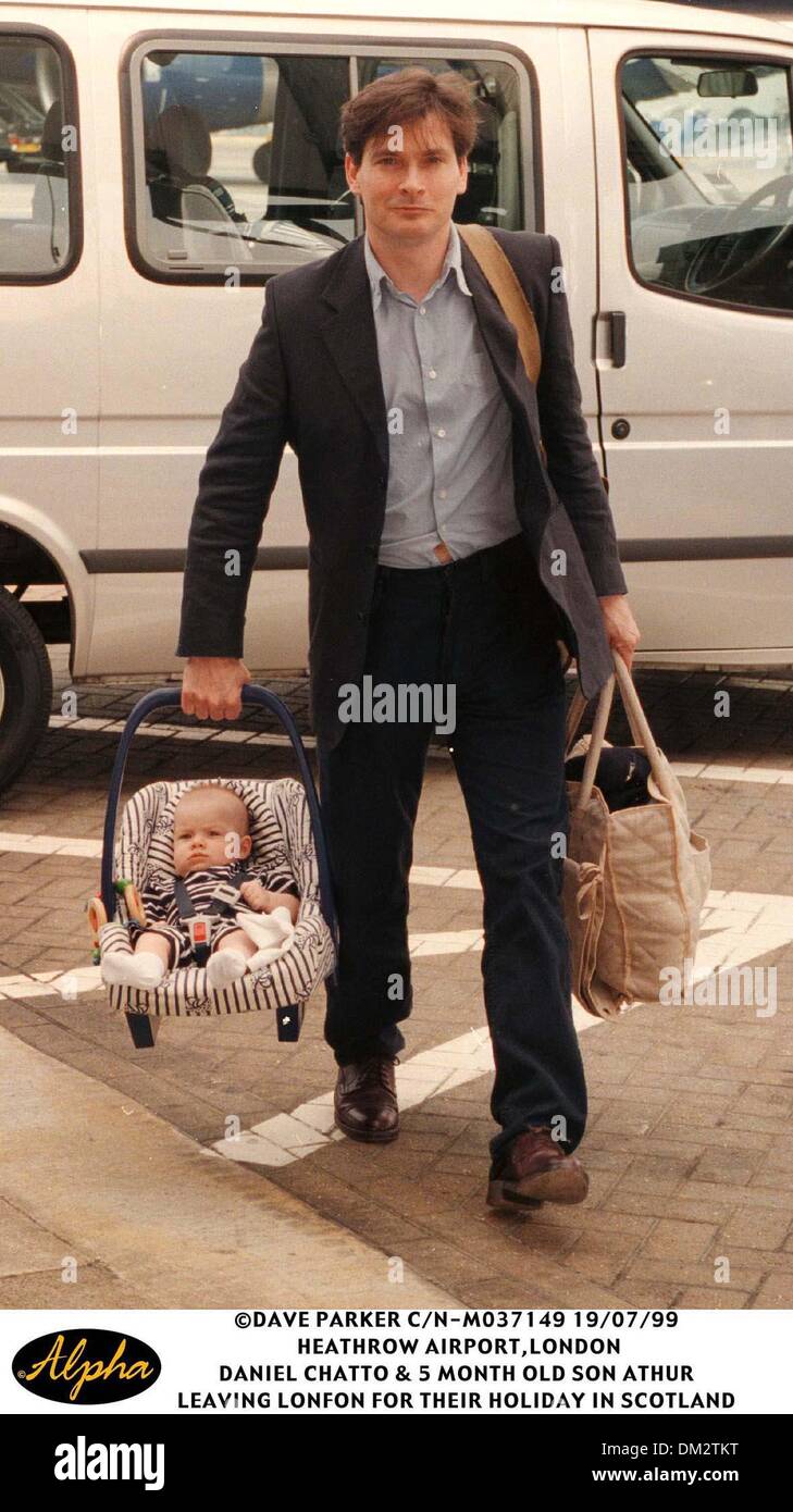 July 19, 1999 - London, Great Britain - 19/07/99 HEATHROW AIRPORT,LONDON .DANIEL CHATTO & THREE MONTH OLD SON ATHUR LEAVING LONDON FOR THEIR HOLIDAY IN SCOTLAND(Credit Image: © Globe Photos/ZUMAPRESS.com) Stock Photo
