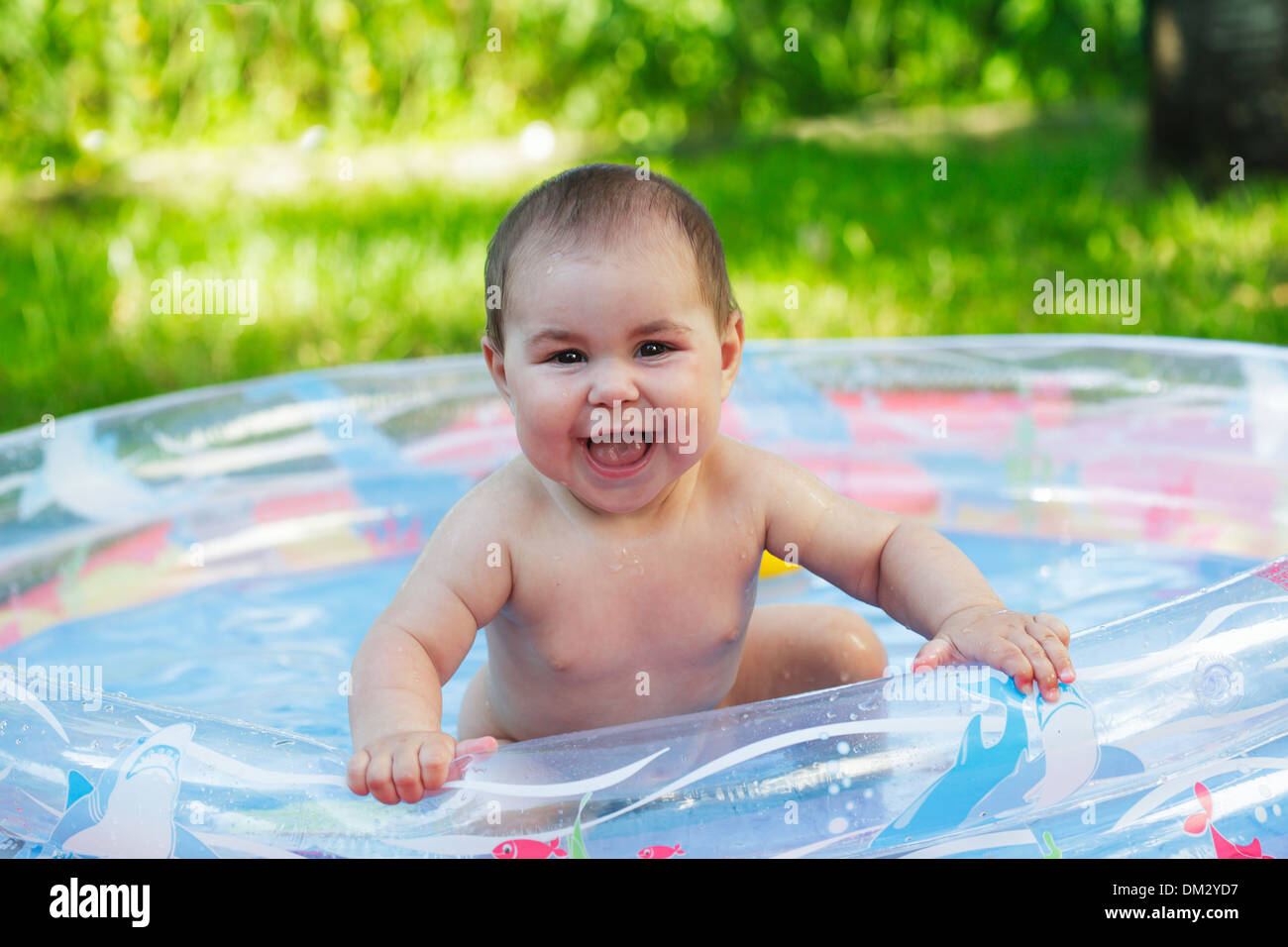 Cute baby in the inflatable pool on grass Stock Photo Alamy
