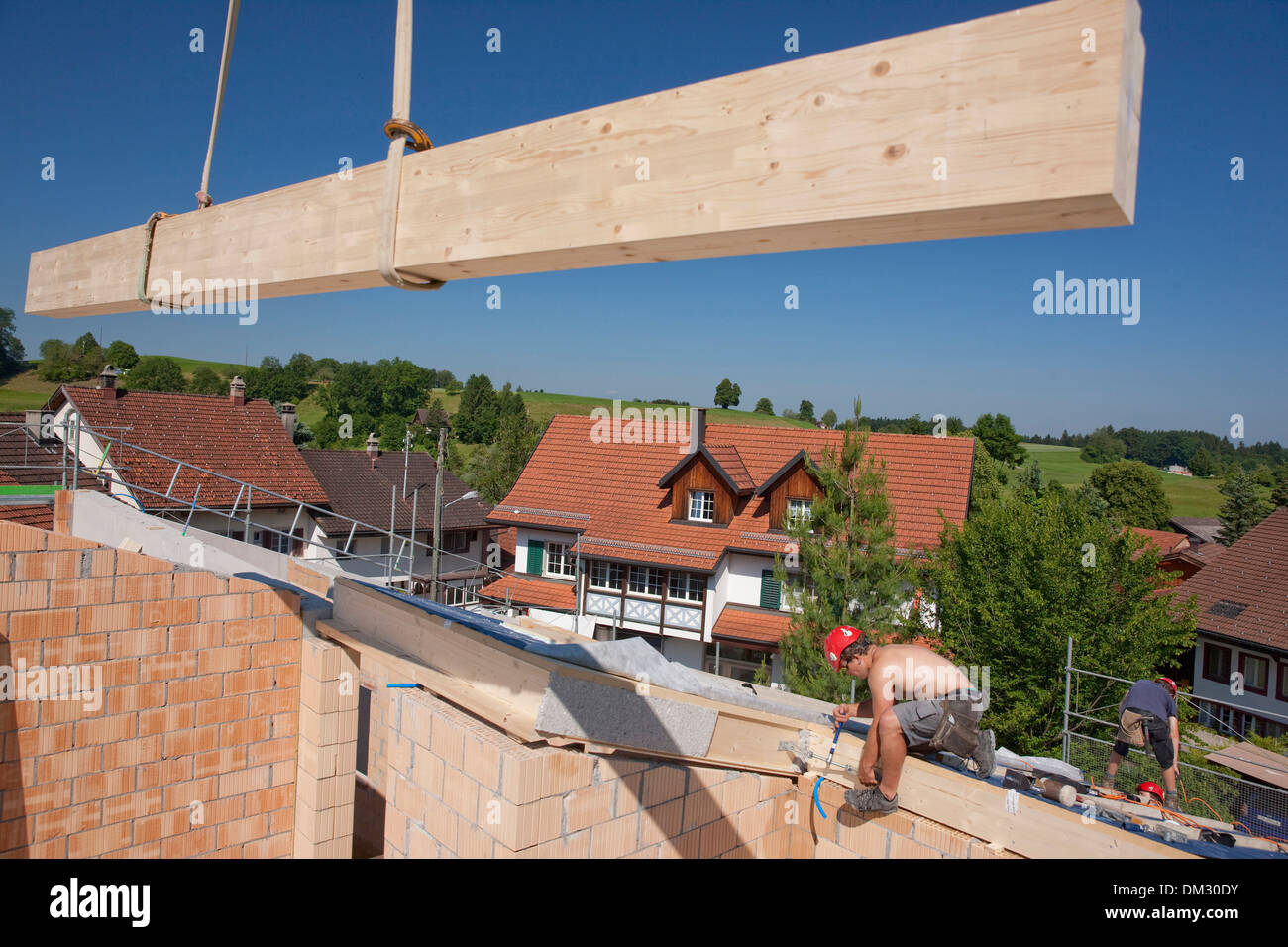 Switzerland Europe timber-frame construction wooden building roof work job occupation profession occupations professions canton Stock Photo