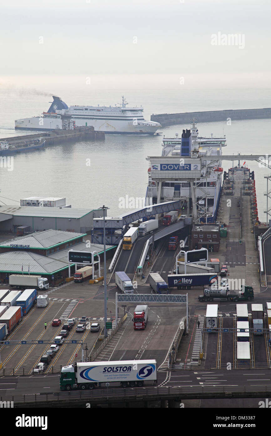 Roll-on roll-off ferries dock at the port of Dover, Kent, UK. Lorries are shown leaving the ferry Stock Photo