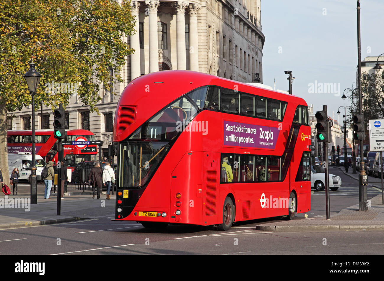 A new Routemaster bus drives through London's Trafalgar Square Stock Photo