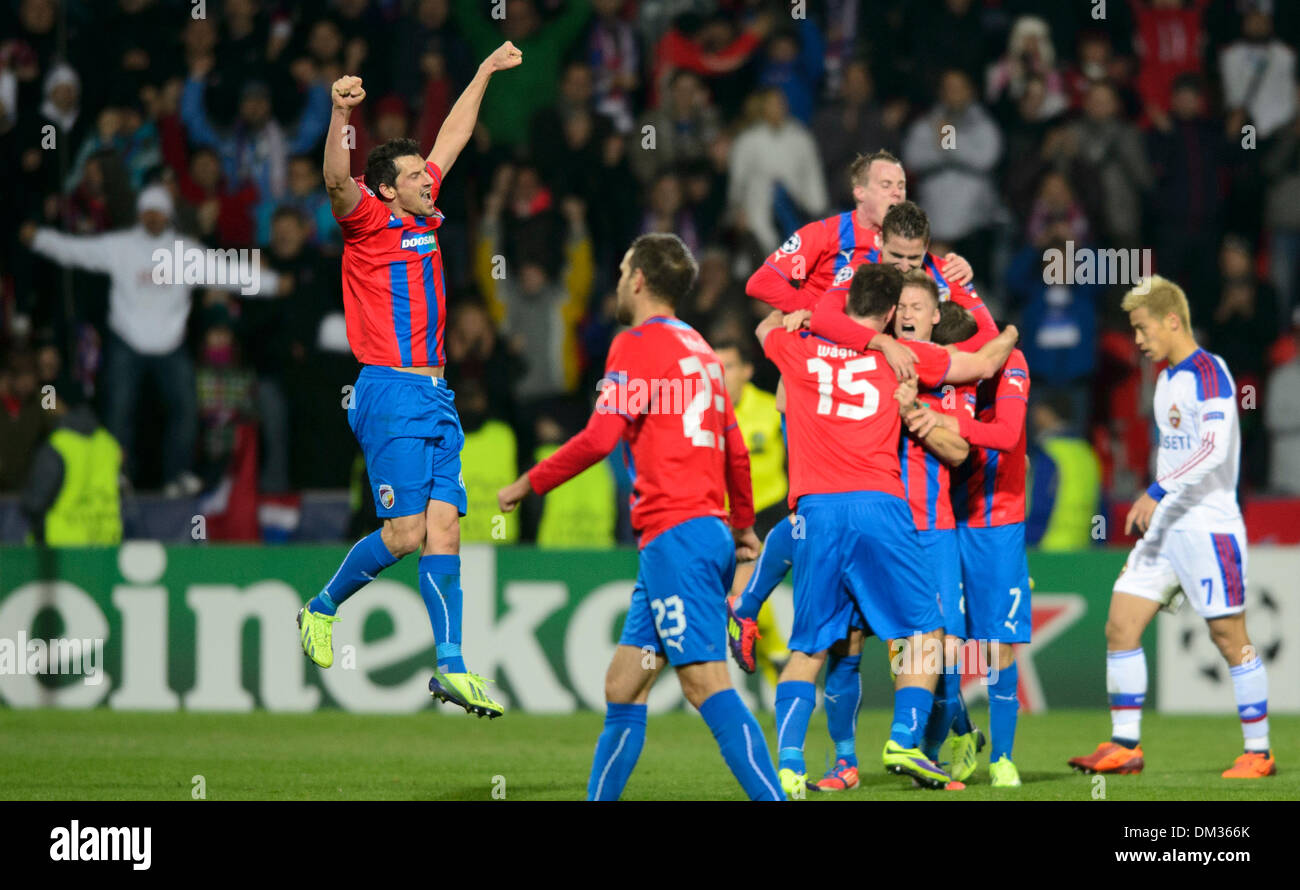 Marian Cisovsky of FC Viktoria Plzen, left, celebrates after winning the 6th round Champions League match against CSKA Moscow played in Plzen, Czech Republic, December 10, 2013. Keisuke Honda of CSKA Moscow at right. (CTK Photo/Michal Kamaryt) Stock Photo