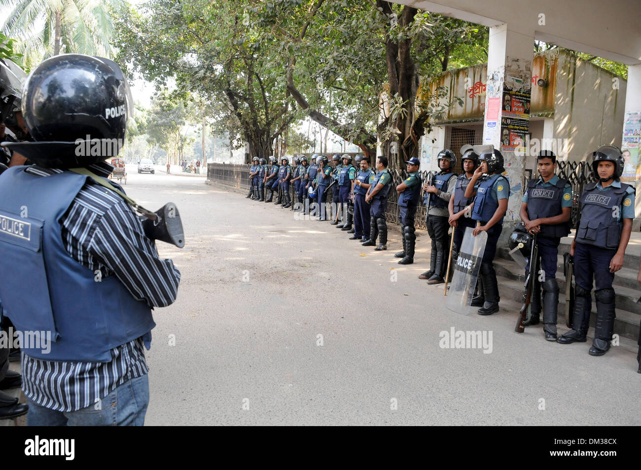 Dhaka, Bangladesh. 11th Dec, 2013. Security officers stand guard in front the Supreme Court during the review petition of convicted war criminal Abdul Quader Mollah in Dhaka, Bangladesh, Dec. 11, 2013. Bangladesh apex court has adjourned till Thursday morning the hearing on the acceptability of the review petition filed by a condemned war criminal who was all set to be executed until a dramatic last gasp intervention saved him from the gallows late on Tuesday. Credit:  Shariful Islam/Xinhua/Alamy Live News Stock Photo