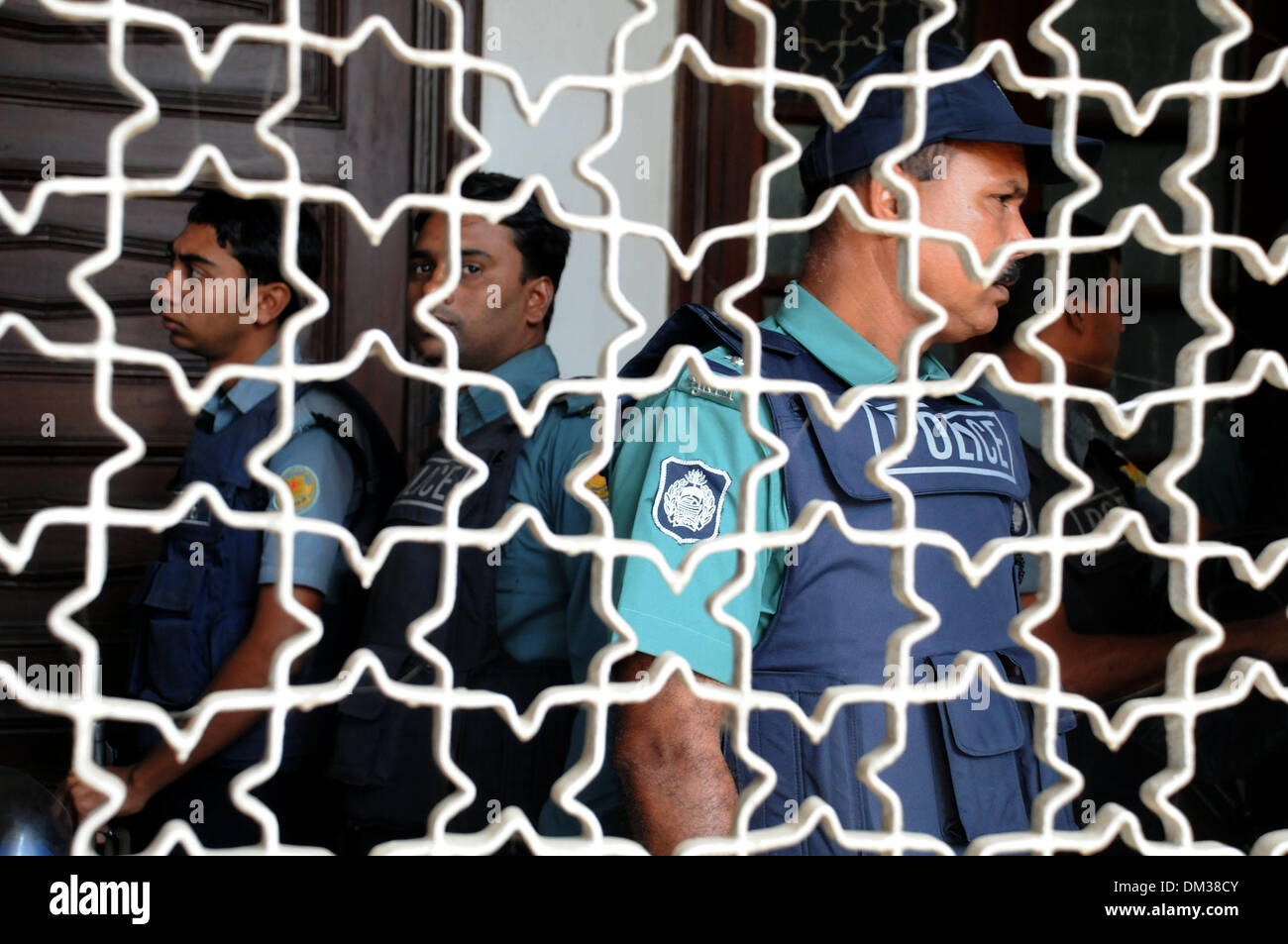 Dhaka, Bangladesh. 11th Dec, 2013. Security officers stand guard in front the Supreme Court during the review petition of convicted war criminal Abdul Quader Mollah in Dhaka, Bangladesh, Dec. 11, 2013. Bangladesh apex court has adjourned till Thursday morning the hearing on the acceptability of the review petition filed by a condemned war criminal who was all set to be executed until a dramatic last gasp intervention saved him from the gallows late on Tuesday. Credit:  Shariful Islam/Xinhua/Alamy Live News Stock Photo