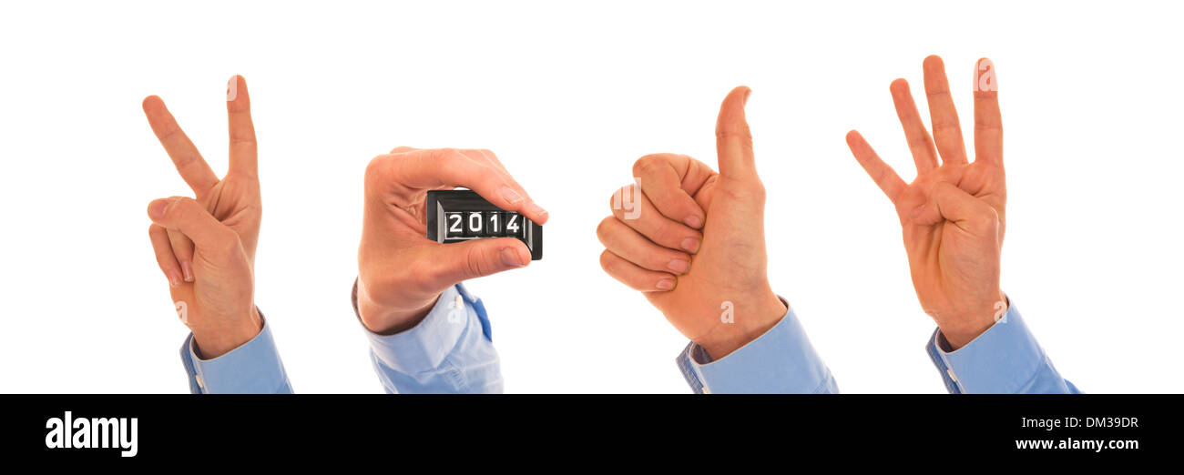 Male hands with analog pedometer display figuring the year 2014 Stock Photo
